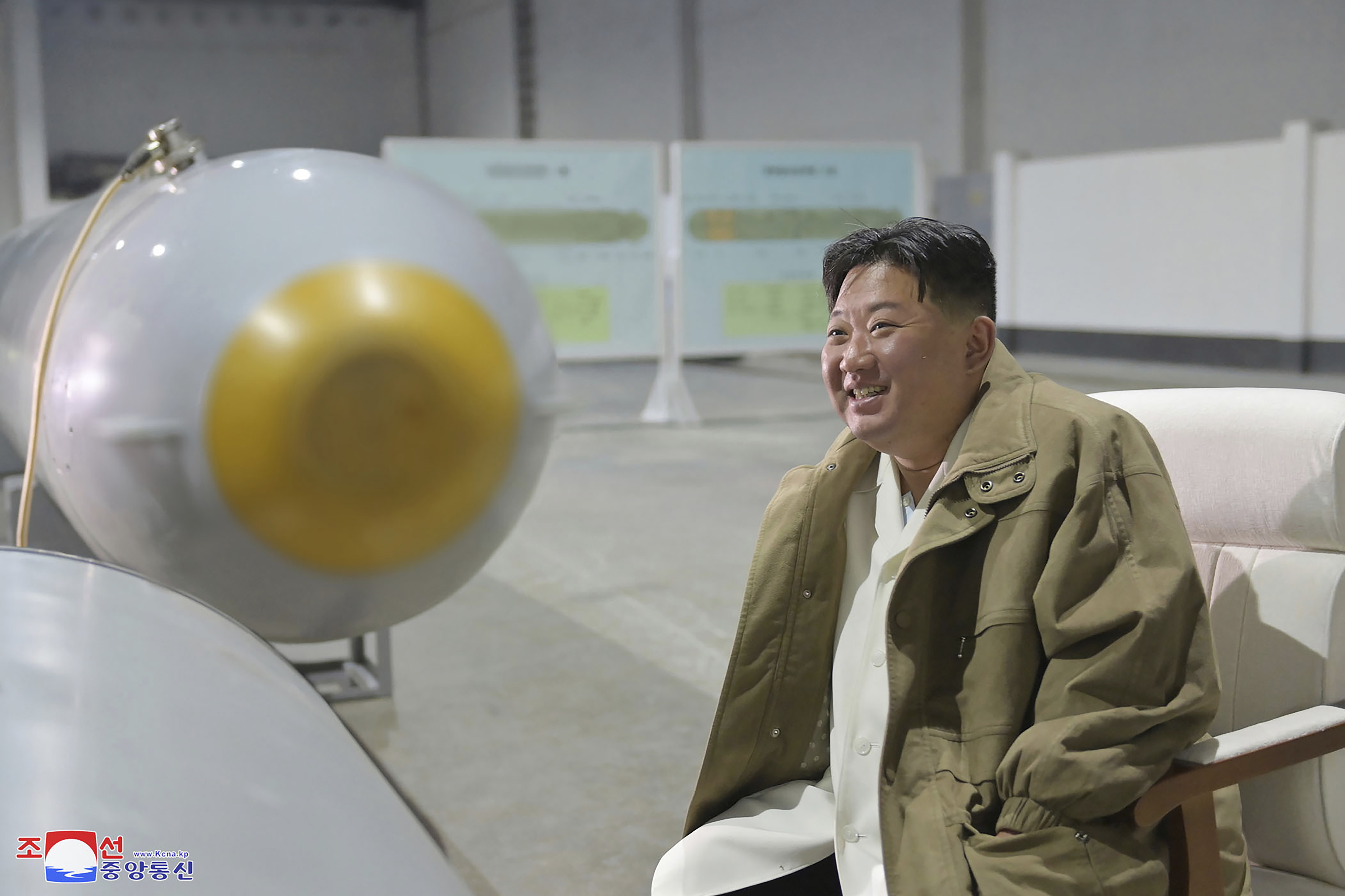 In this undated photo provided by the North Korean government, North Korean leader Kim Jong Un inspects what it says unmanned underwater nuclear attack craft "Haeil" which was tested during exercises held on March 21 - 23, 2023 in North Korea. 