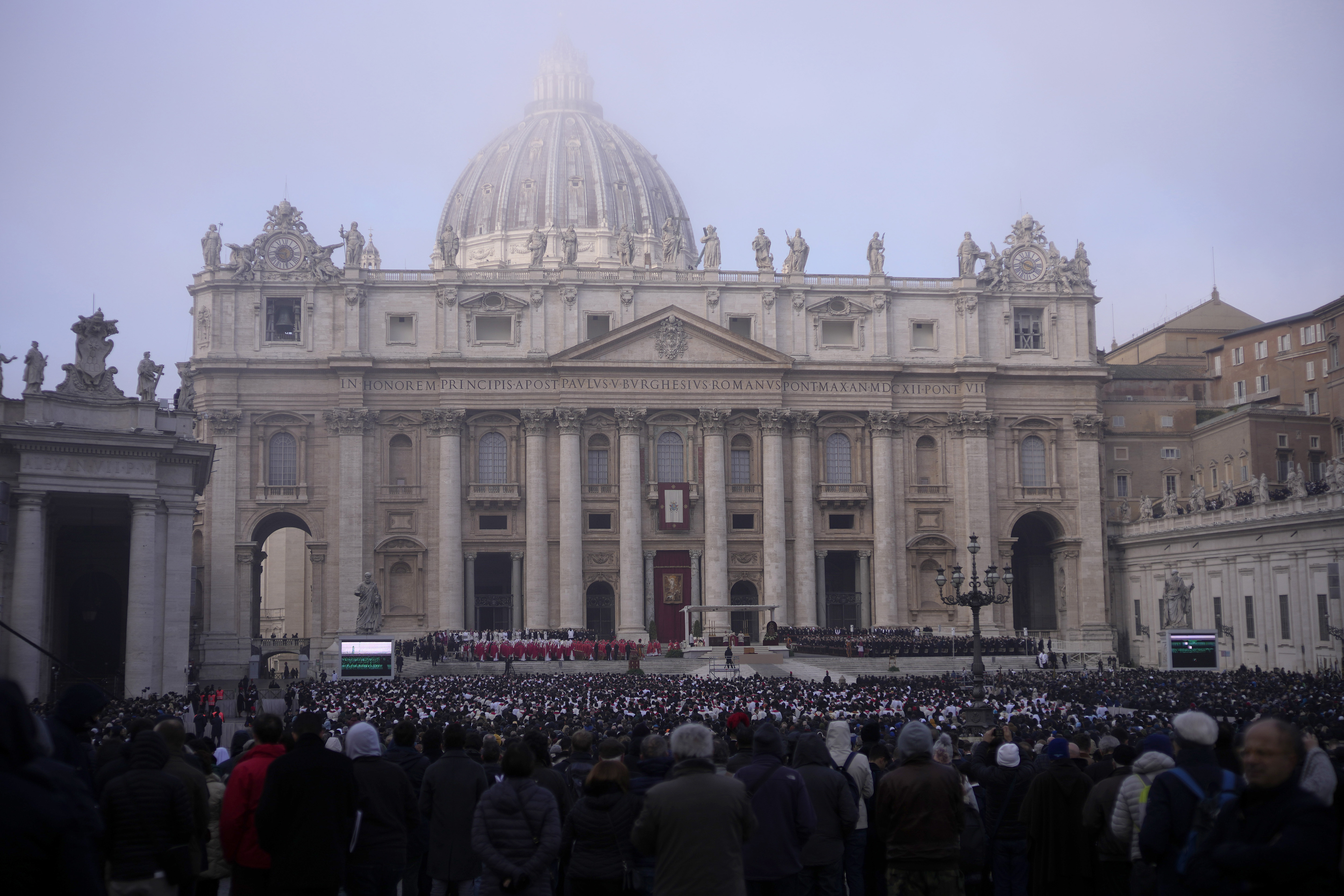 Pope Francis, centre, starts a funeral mass as the coffin of late Pope Emeritus Benedict XVI is placed at St. Peter's Square at the Vatican, Thursday, Jan. 5, 2023.