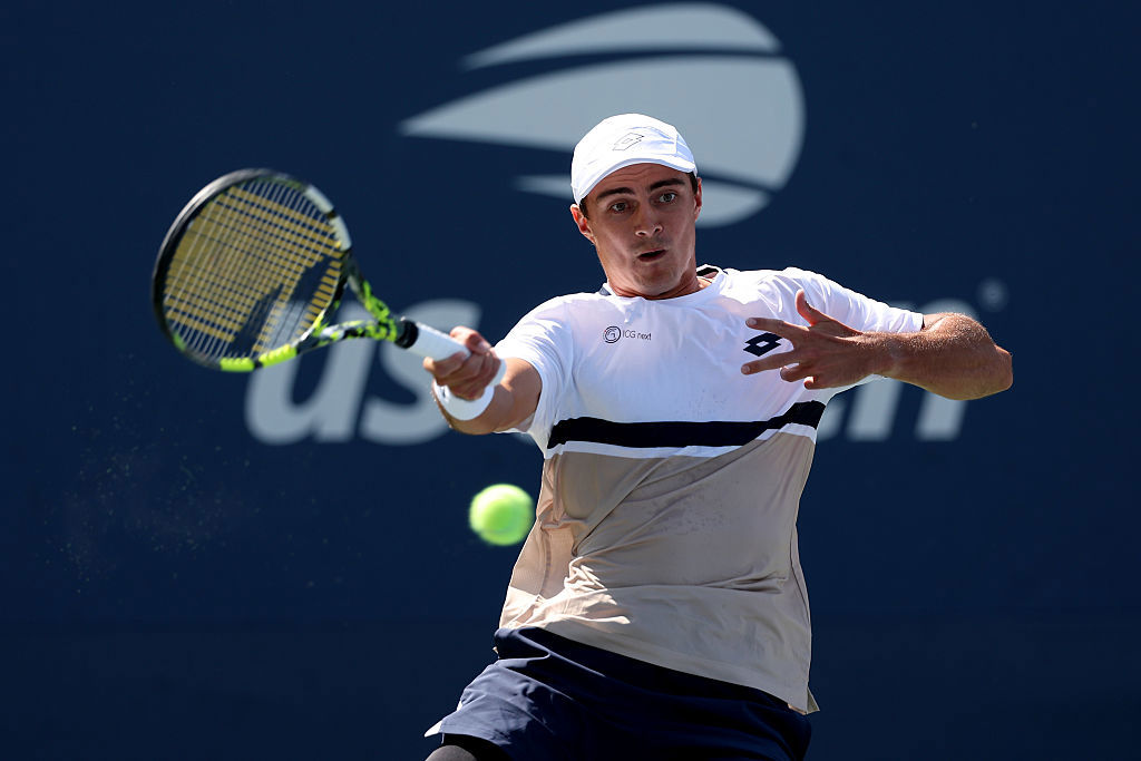 Adam Walton of Australia plays a forehand shot against Ugo Humbert of France.