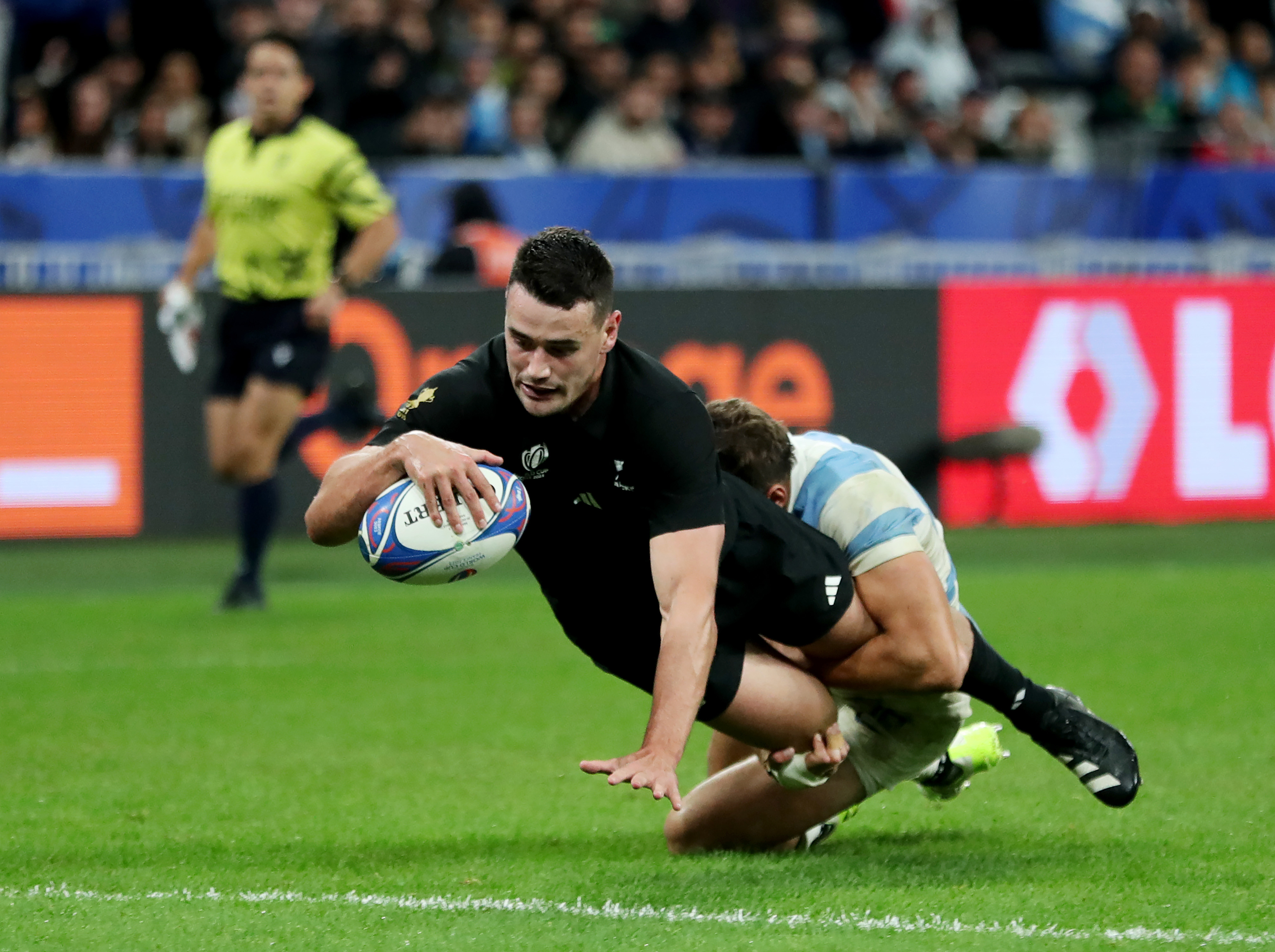 Will Jordan of New Zealand scores his team's seventh try.