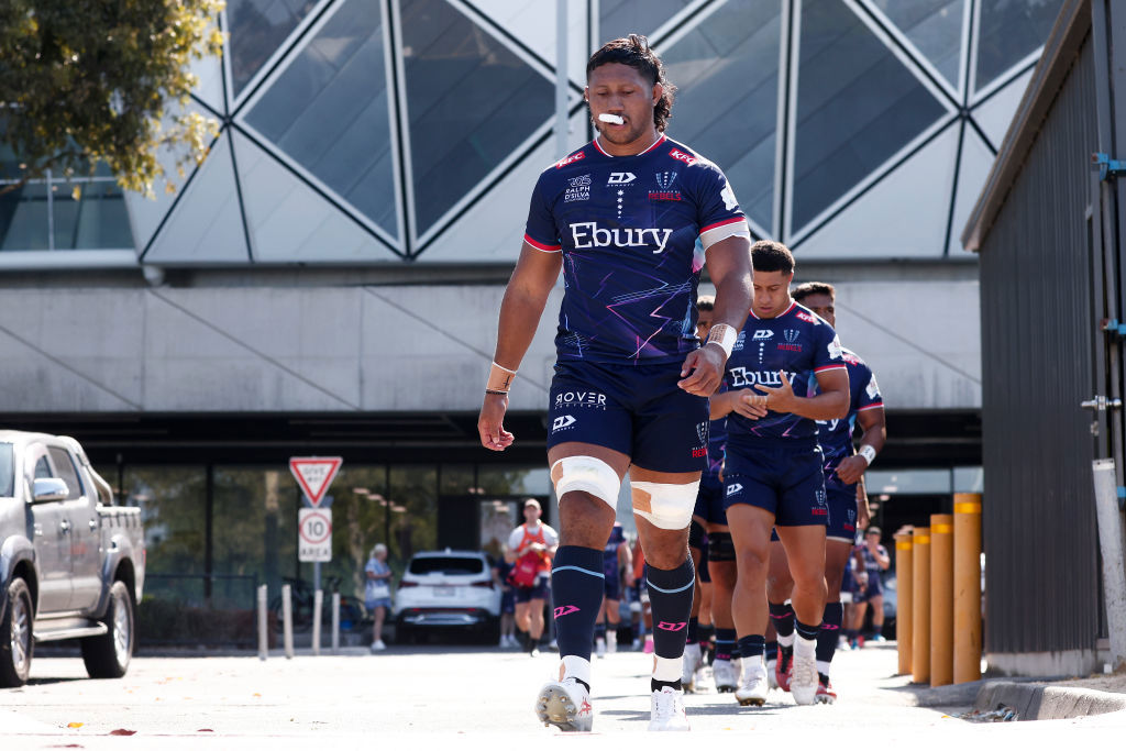 Rob Leota of the Rebels leads the team out at Gosch's Paddock.