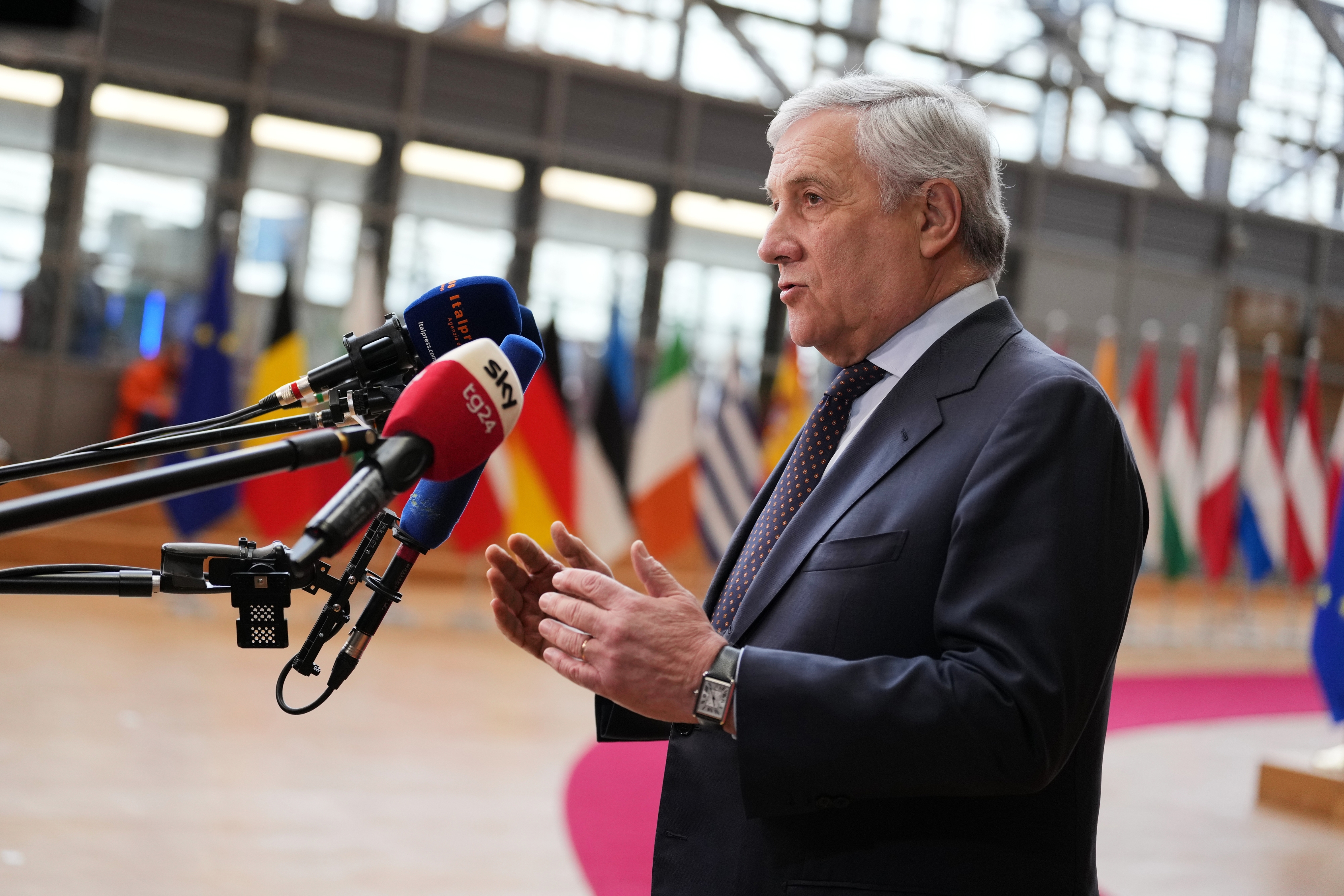 Italy's Foreign Minister Antonio Tajani speaks with the media as he arrives for a meeting of EU foreign ministers at the European Council building in Brussels, Monday, Feb. 23, 2026. (AP Photo/Virginia Mayo)
