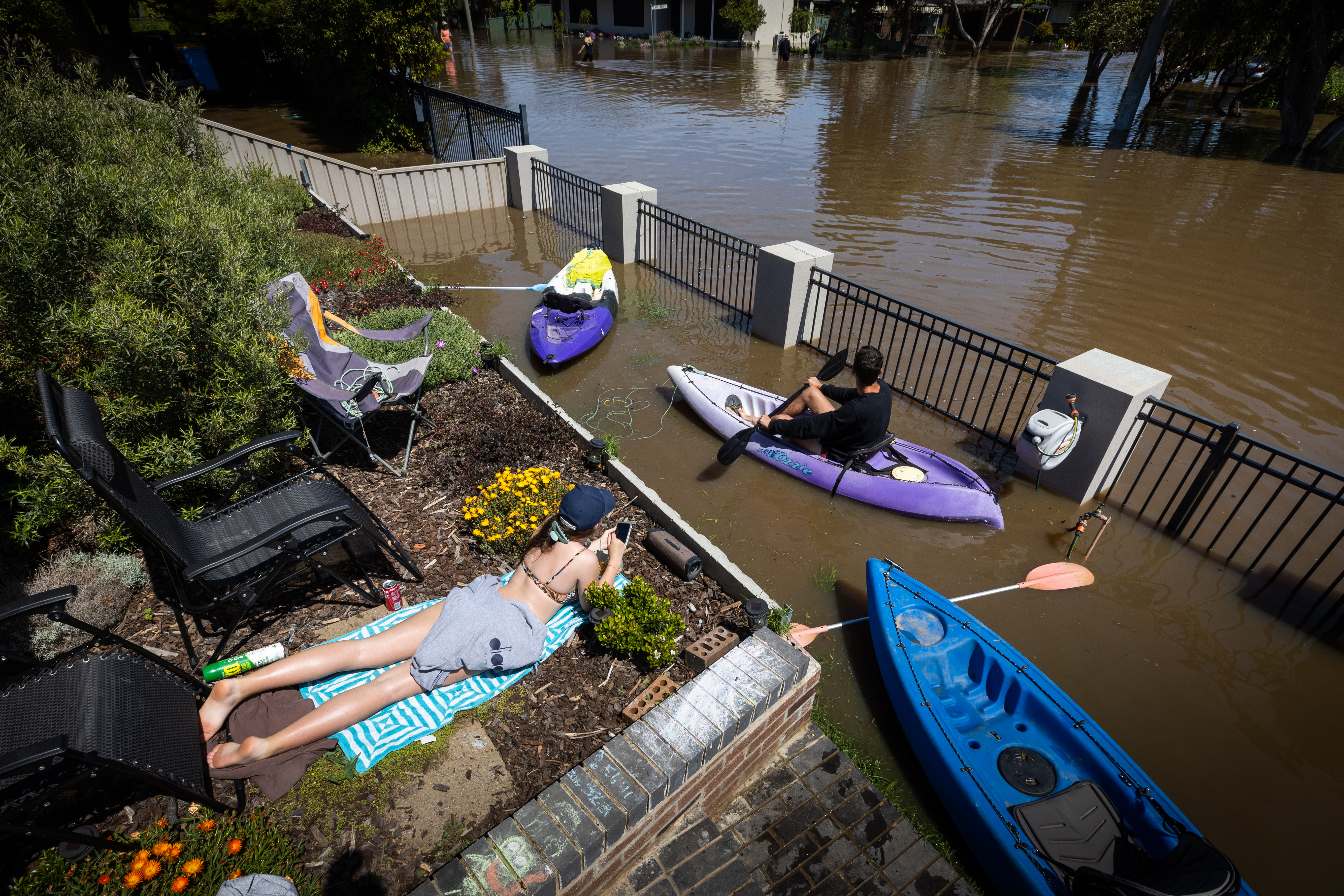 The sun returns and a spot of tanning and paddling is the order of the day in South Shepparton, as the river could be in flood for a week.