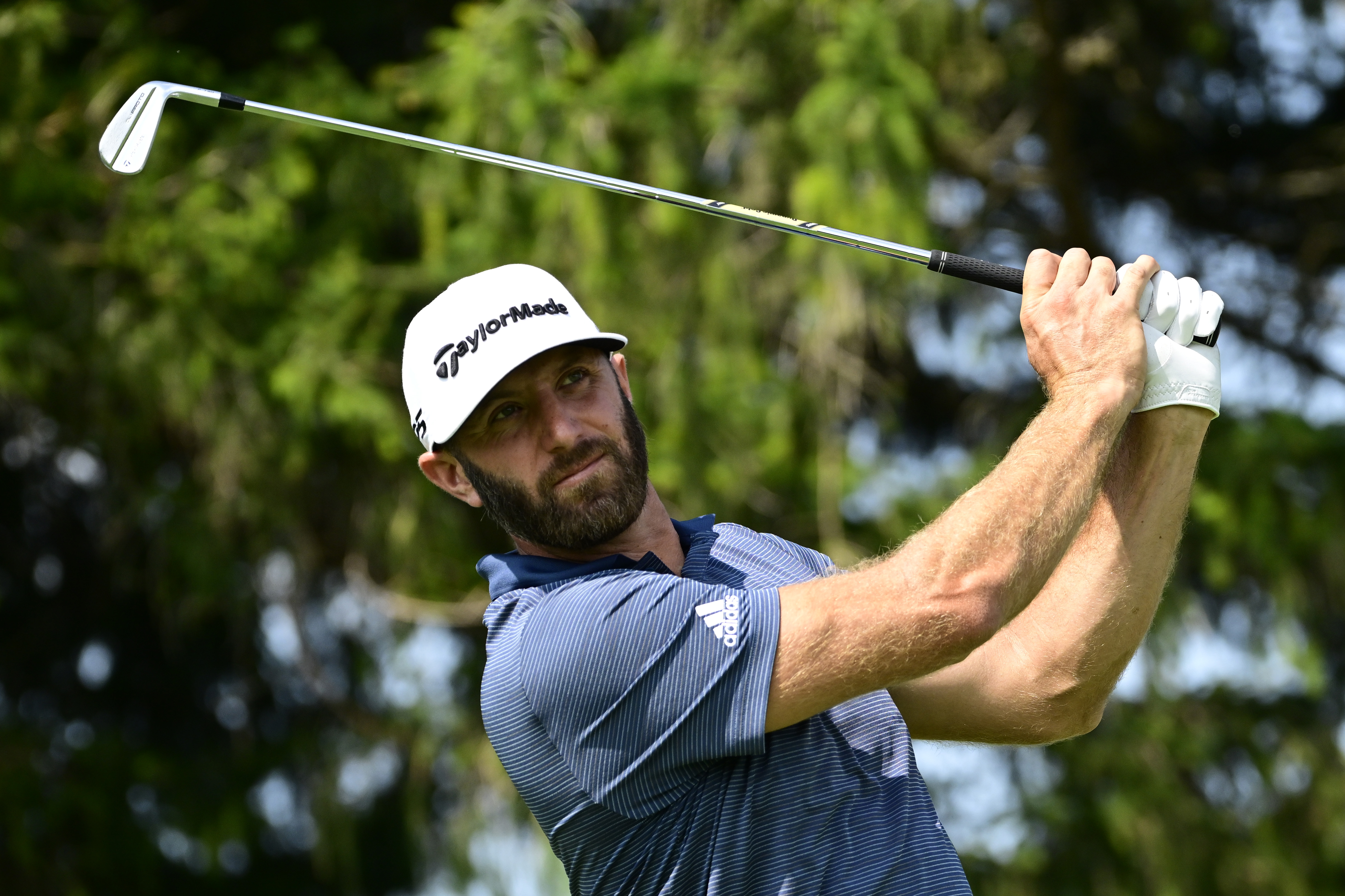 Team Captain Dustin Johnson of 4 Aces GC plays his shot on the third tee during Day One of the LIV Golf Invitational - Chicago at Rich Harvest Farms on September 16, 2022 in Sugar Grove, Illinois. (Photo by Quinn Harris/Getty Images)