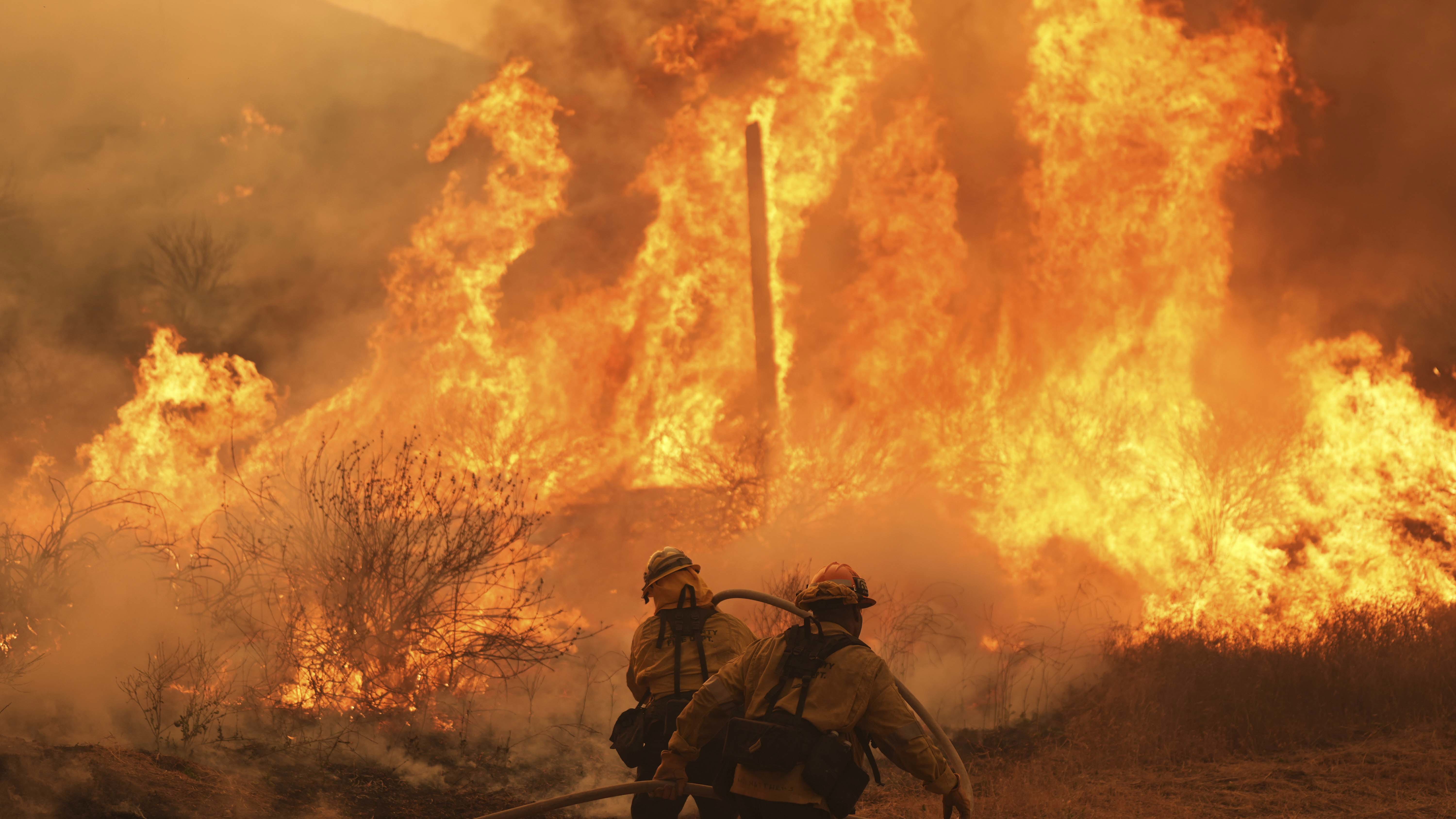 Firefighters make progress against blaze near LA that forced thousands to flee 
