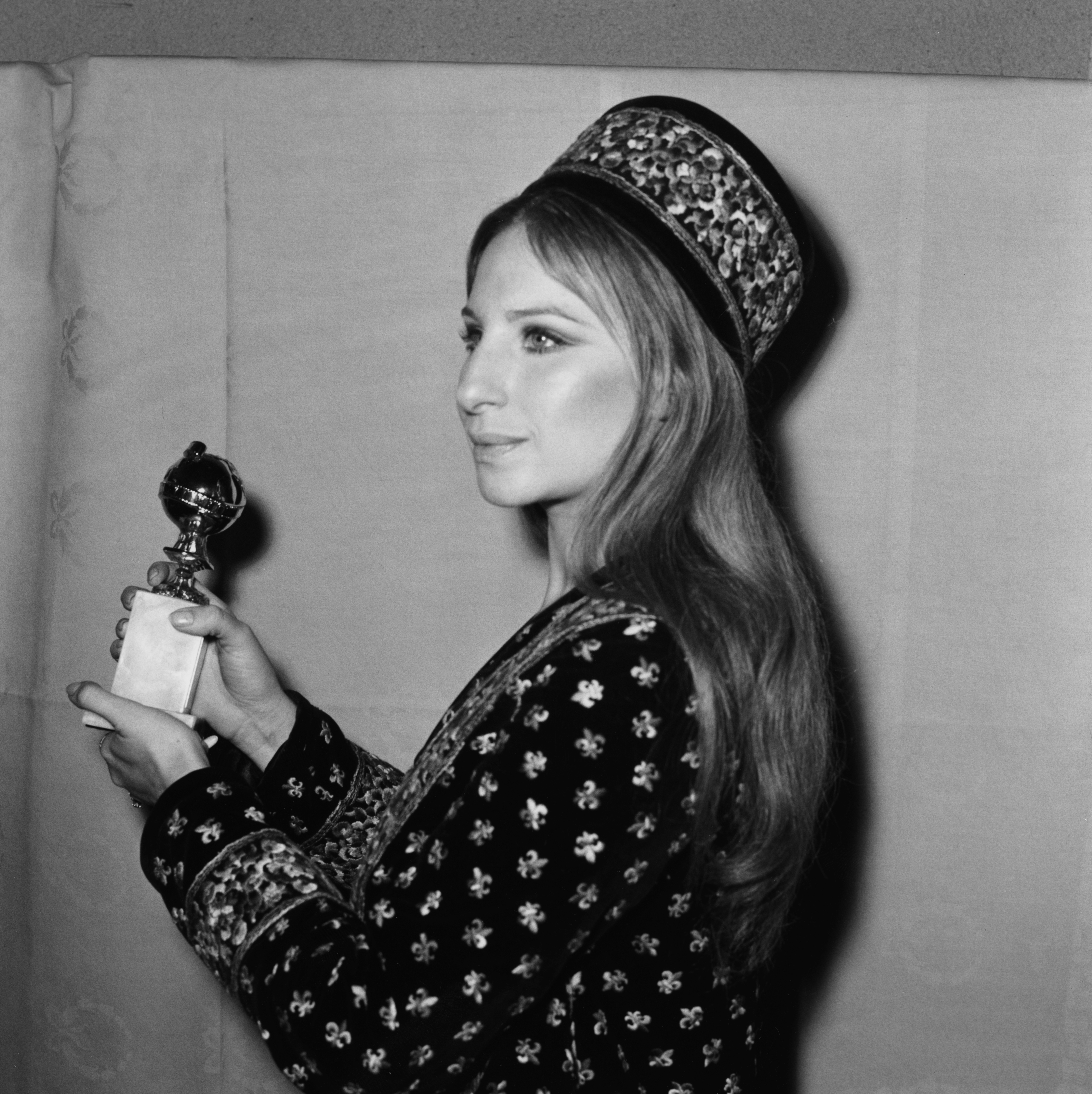 Barbra Streisand holding her award at the Golden Globe Awards, Los Angeles, February 1971.