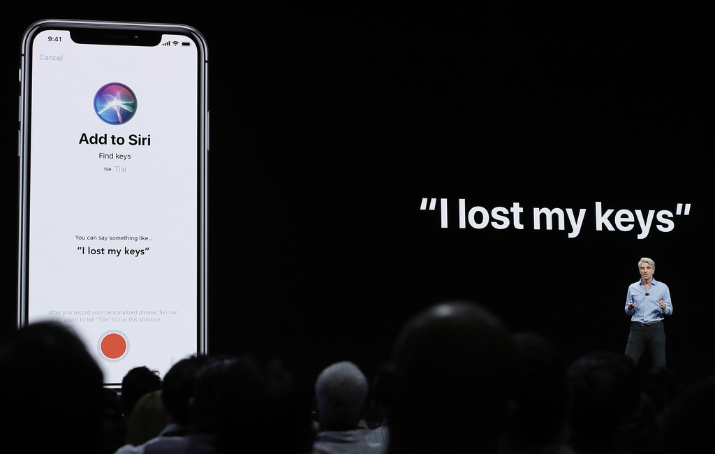 FILE - Craig Federighi, Apple's senior vice president of Software Engineering, speaks about Siri during an announcement of new products at the Apple Worldwide Developers Conference in San Jose, Calif., June 4, 2018.  (AP Photo/Marcio Jose Sanchez, File)