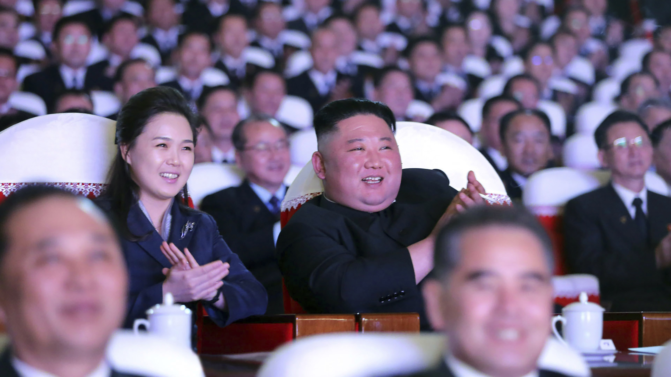 In this photo provided by the North Korean government, North Korean leader Kim Jong Un and his wife Ri Sol Ju watch a performance marking birth anniversary of Kim Jong Il, Pyongyang, North Korea.