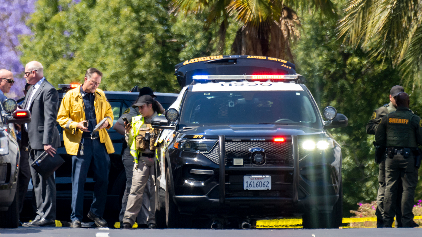 Orange Sheriff deputies and investigators gather on Calle Sonora after one person died and four people were critically injured in a shooting at a Geneva Presbyterian Church in Laguna Woods on Sunday, May 15, 2022. (Photo by Leonard Ortiz, Orange County Register/SCNG)