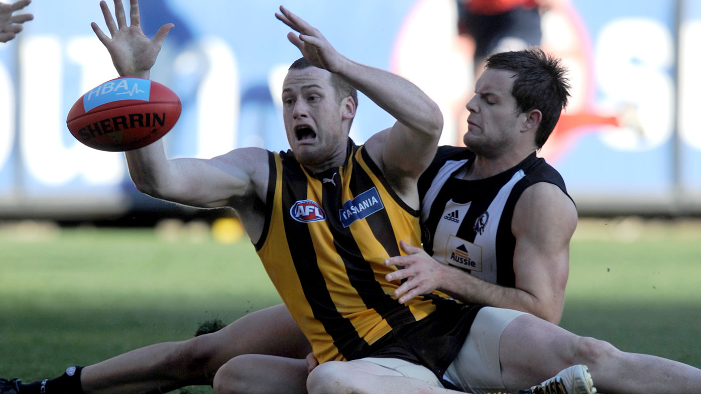 Jarryd Roughead tackled by Collingwood's Nathan Brown in 2010.