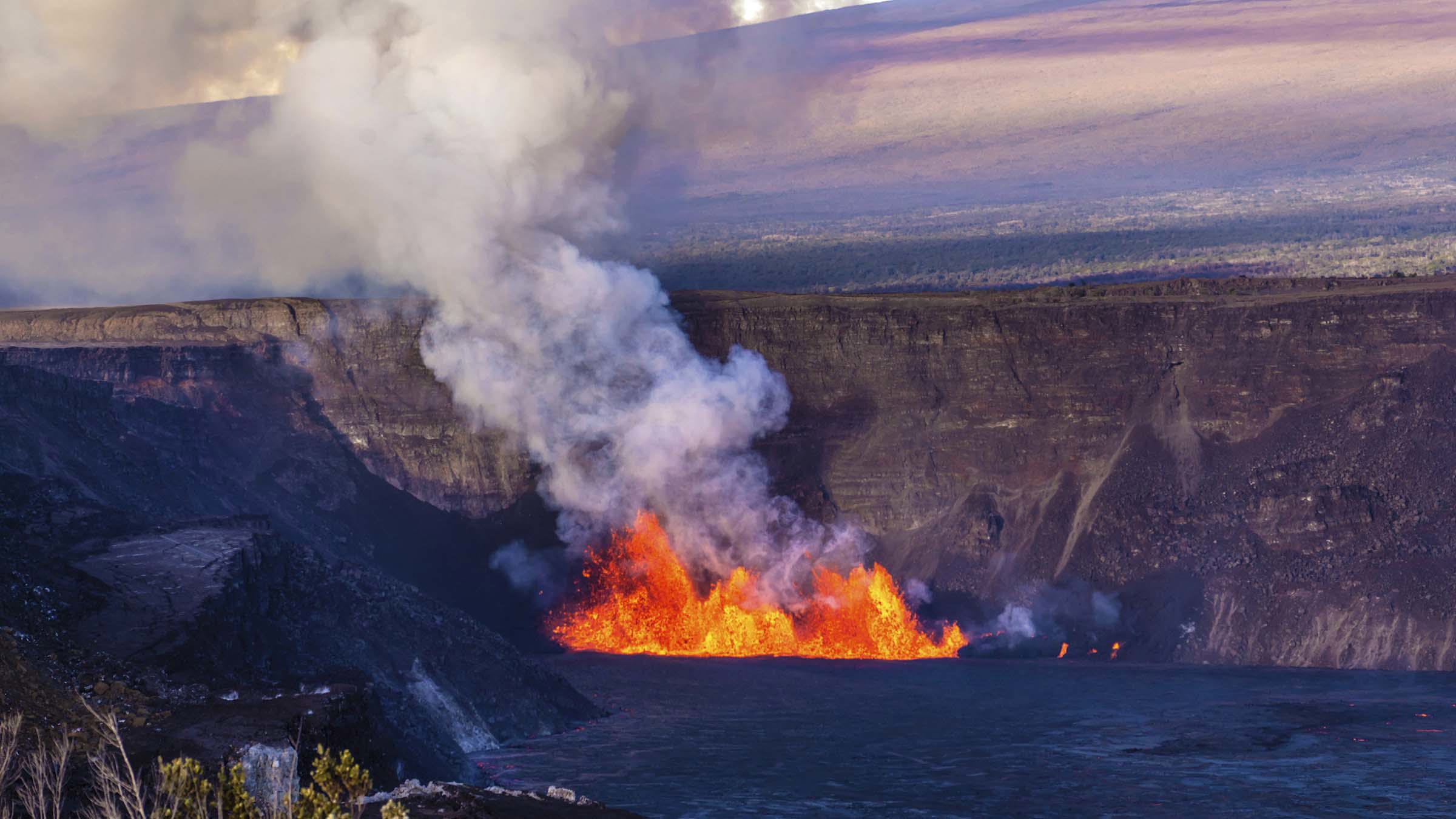 In this photo provided by the National Park Service, an eruption takes place on the summit of the Kilauea volcano in Hawaii, Monday, Dec. 23, 2024. (Janice Wei/NPS via AP)