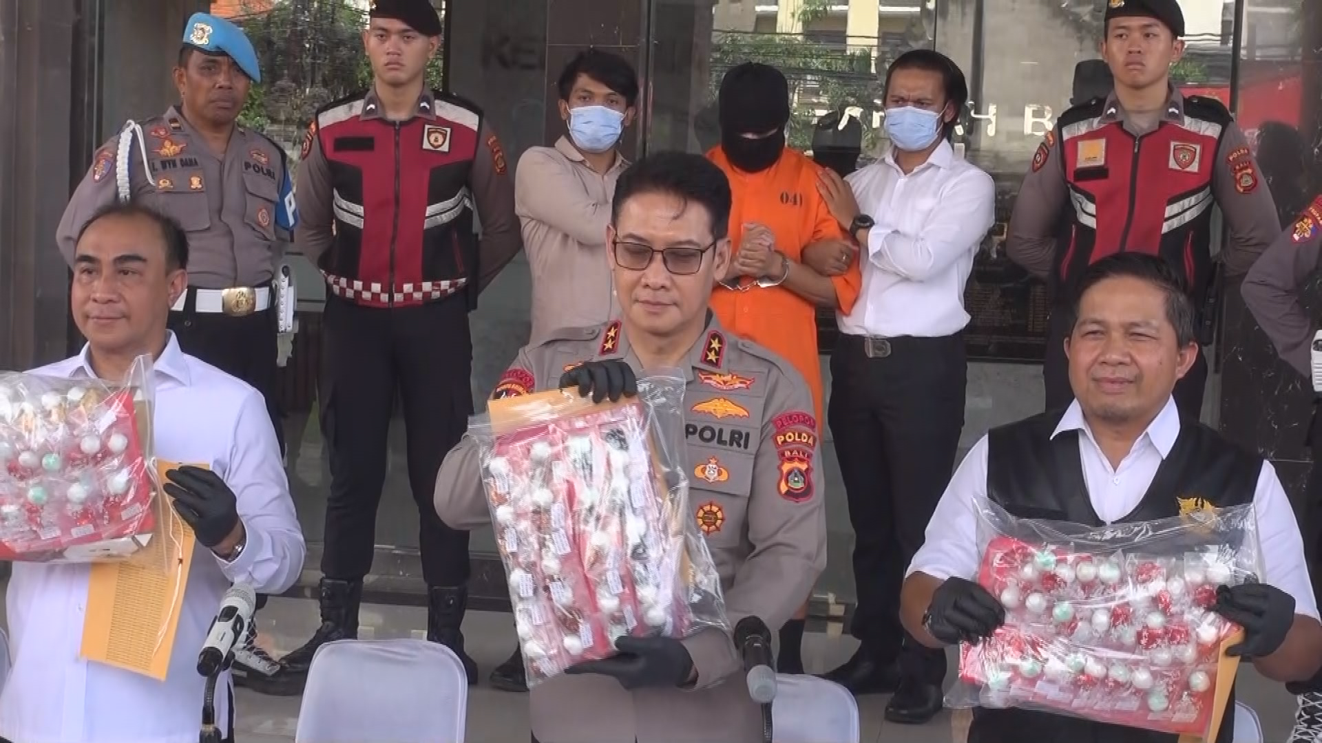 Today, police showed off his alleged haul of drugs - 1.7 kilograms of cocaine hidden inside chocolate wrappers. 