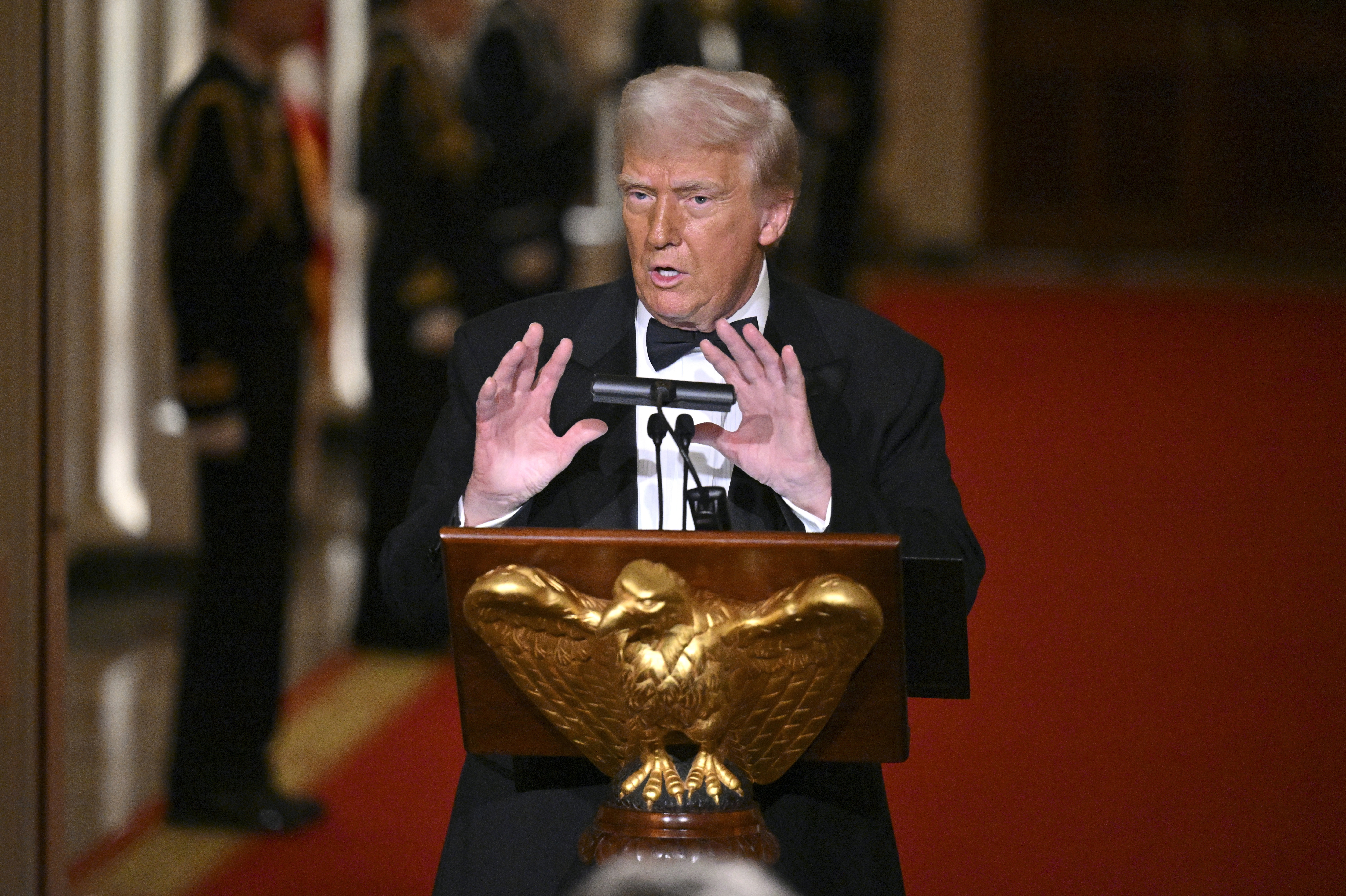 President Donald Trump addresses the National Governors Association dinner and reception in the East Room of the White House Saturday, Feb. 22, 2025, in Washington. (Pool via AP) 