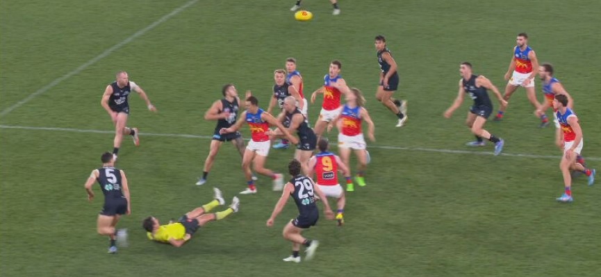 Carlton's Adam Cerra makes contact with the umpire.