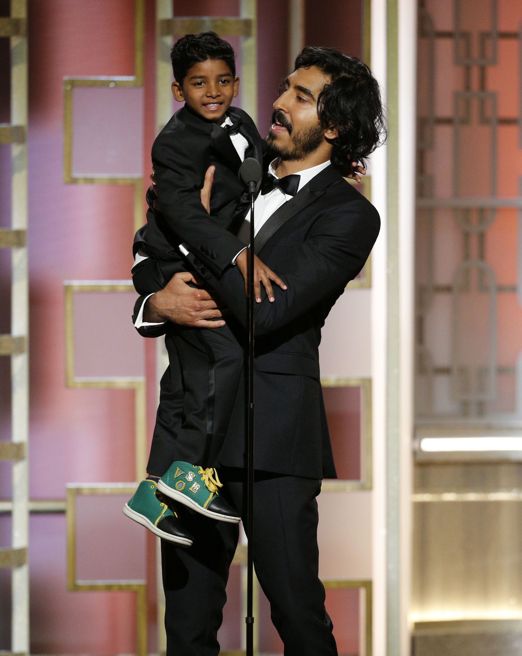 74th ANNUAL GOLDEN GLOBE AWARDS -- Pictured: Sunny Pawar, Dev Patel, Presenters, at the 74th Annual Golden Globe Awards held at the Beverly Hilton Hotel on January 8, 2017 -- (Photo by: Paul Drinkwater/NBC)