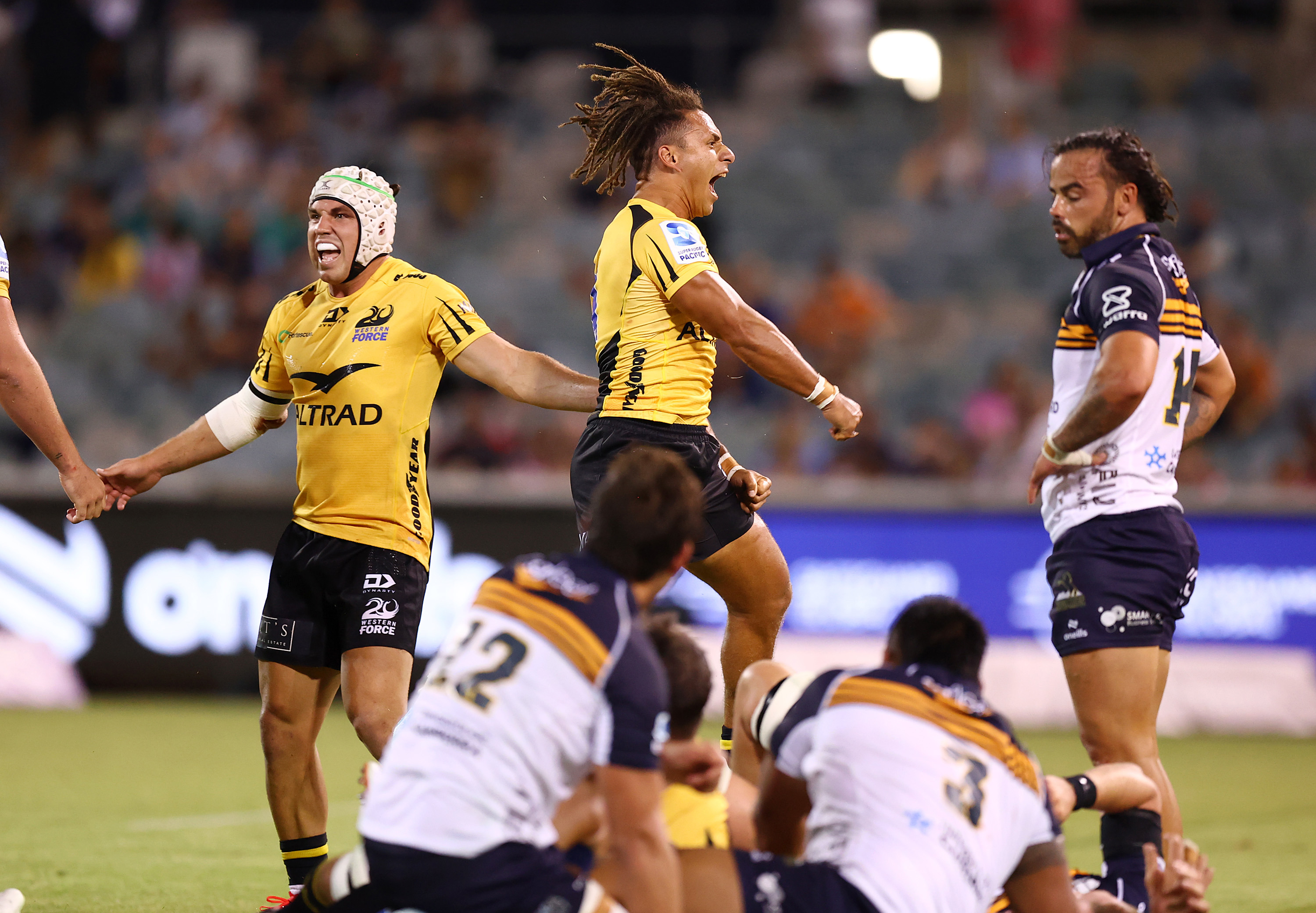 Western Force players celebrate winning the round two Super Rugby Pacific match.
