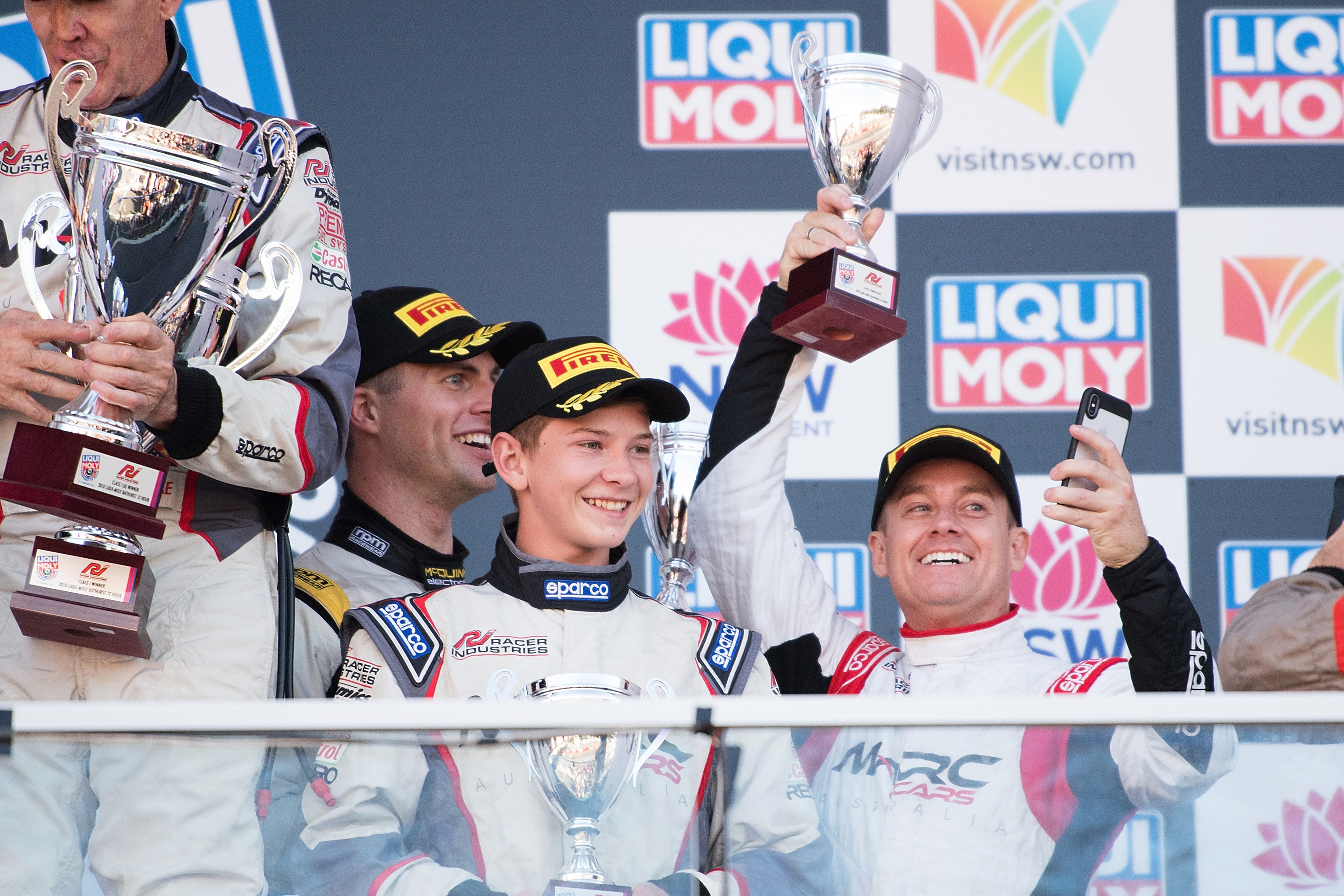 Grand Denyer stands on the Mount Panorama podium at the 2018 Bathurst 12 Hour with Tyler Everingham (middle) and Garry Jacobson.