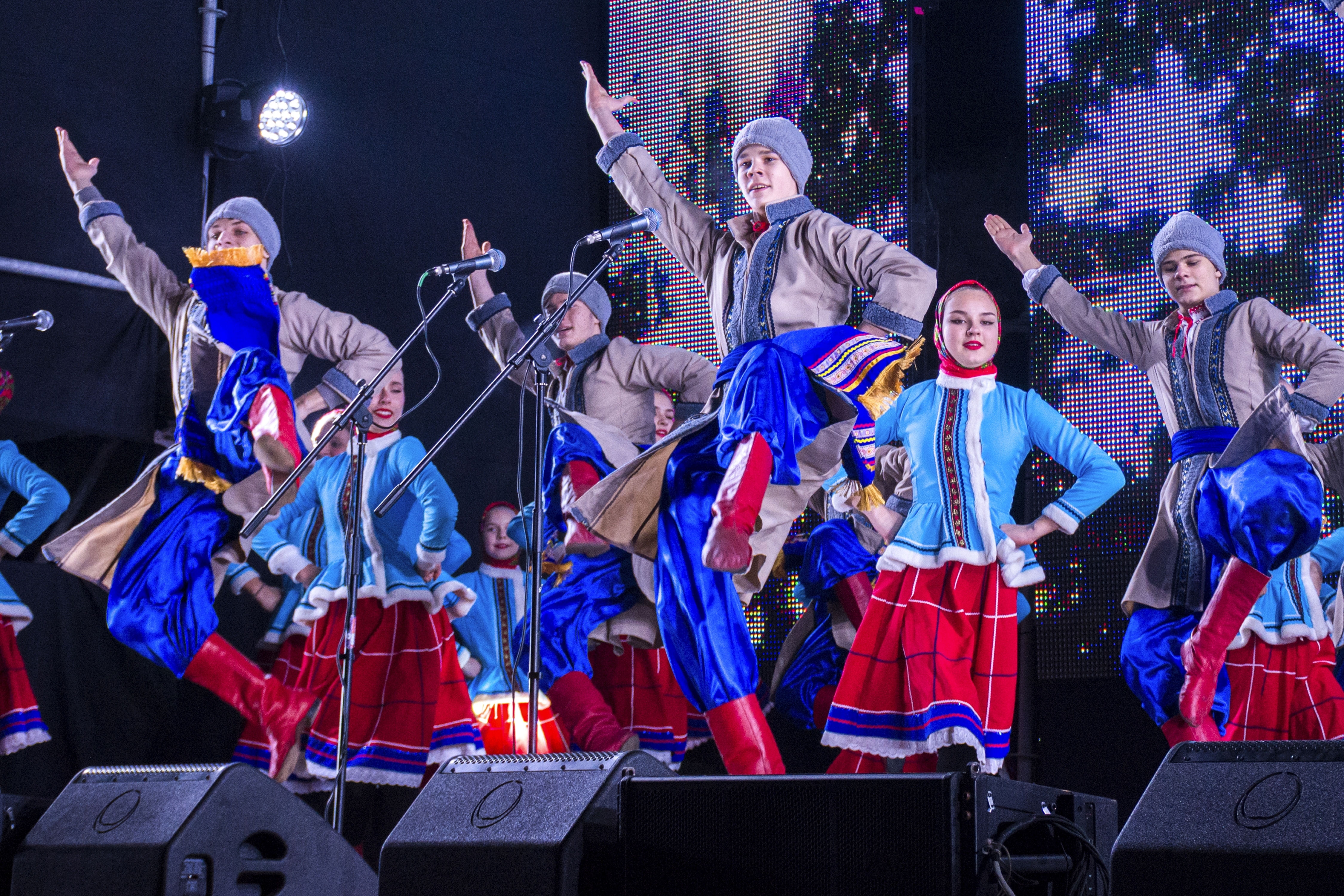 Young artists perform as people gather at the Christmas tree decorated for Christmas and the New Year festivities in Luhansk, the capital of Russian-controlled Luhansk region, eastern Ukraine, Friday, Dec. 23, 2022. 