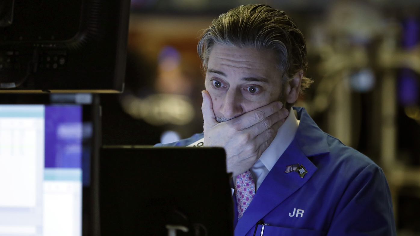 Trader John Romolo works on the floor of the New York Stock Exchange today.