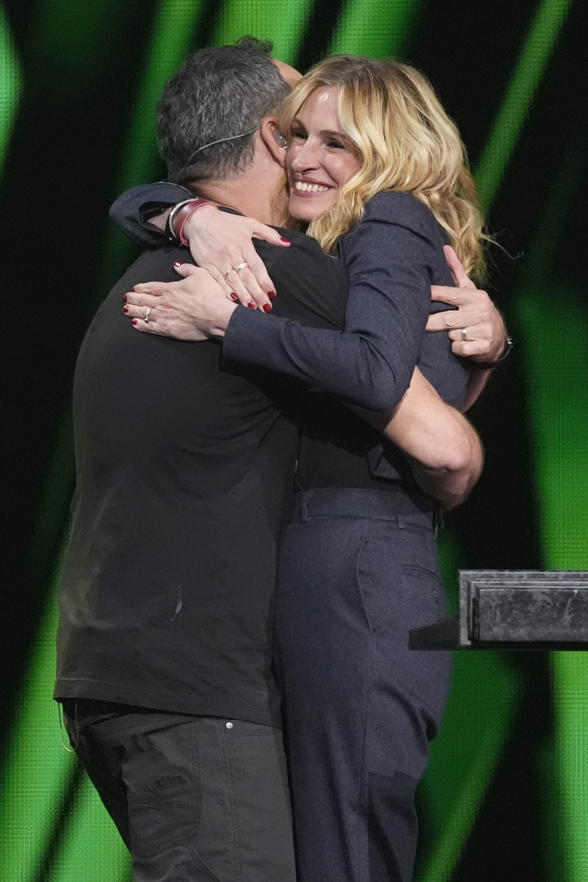 Dave Matthews, left, and Julia Roberts embrace during the 39th Annual Rock & Roll Hall of Fame Induction Ceremony on Saturday, Oct. 19, 2024, at Rocket Mortgage FieldHouse in Cleveland. (AP Photo/Chris Pizzello)