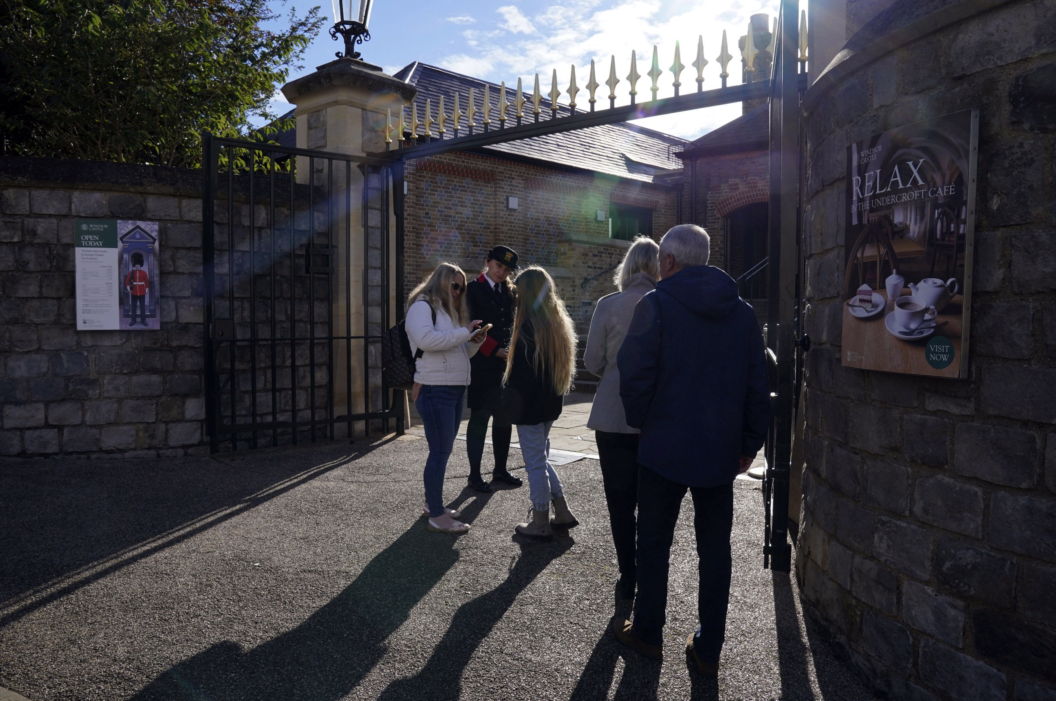 People queue outside as Windsor Castle and St George's Chapel, which is reopened to public for first time since Queen Elizabeth II's death, in Windsor, England, Thursday, Sept. 29, 2022. 