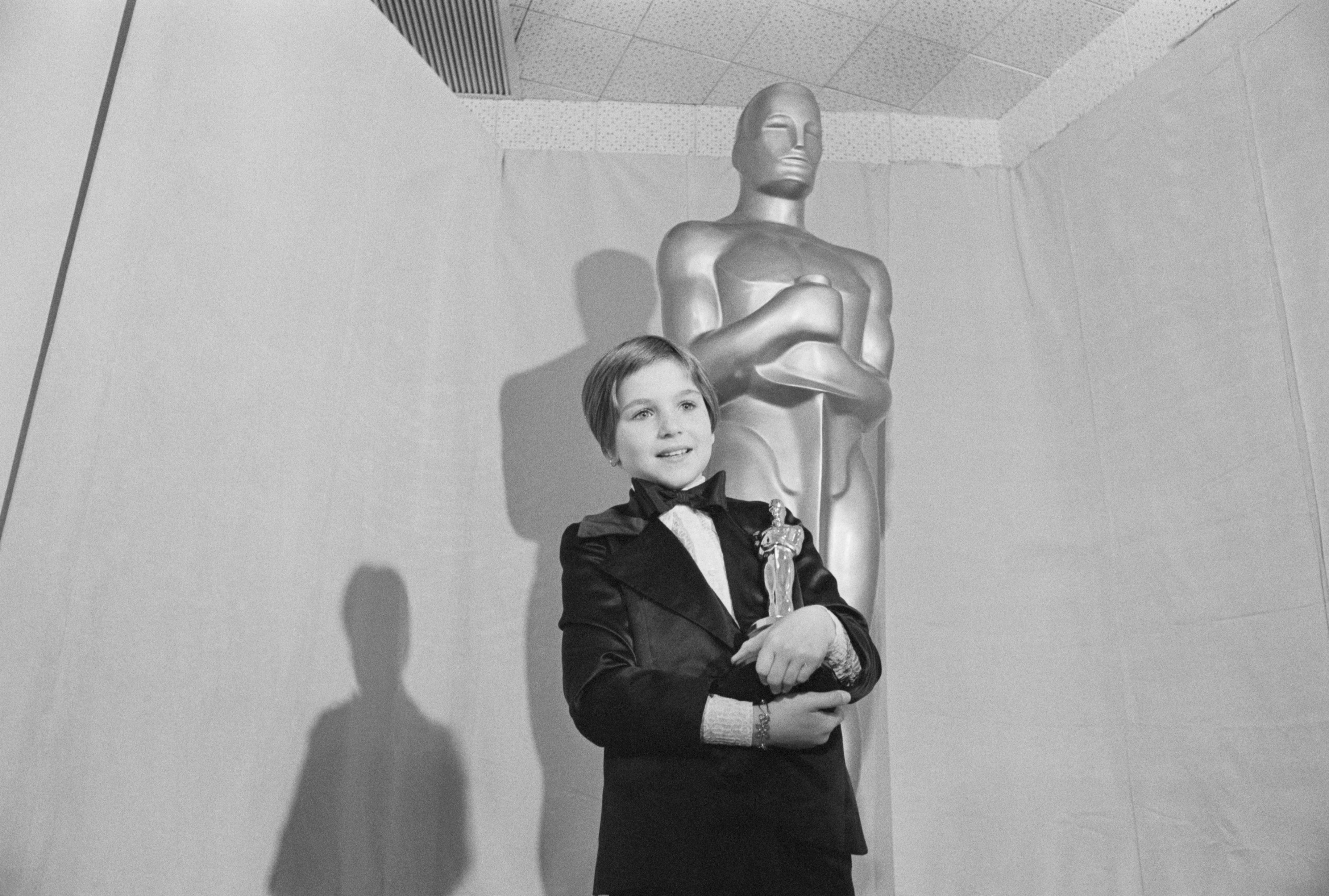 Tatum O'Neal holds the Oscar she won for working alongside her father in the movie Paper Moon. At 9 years old, O'Neal was one of the youngest Oscar winners ever.