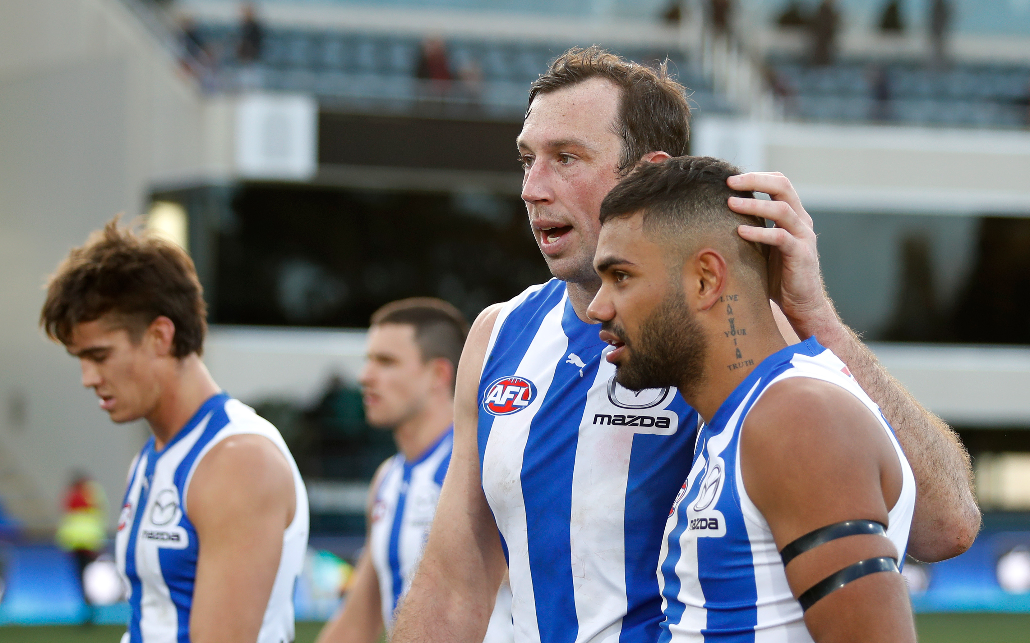 Tarryn Thomas is comforted by Todd Goldstein after a loss.