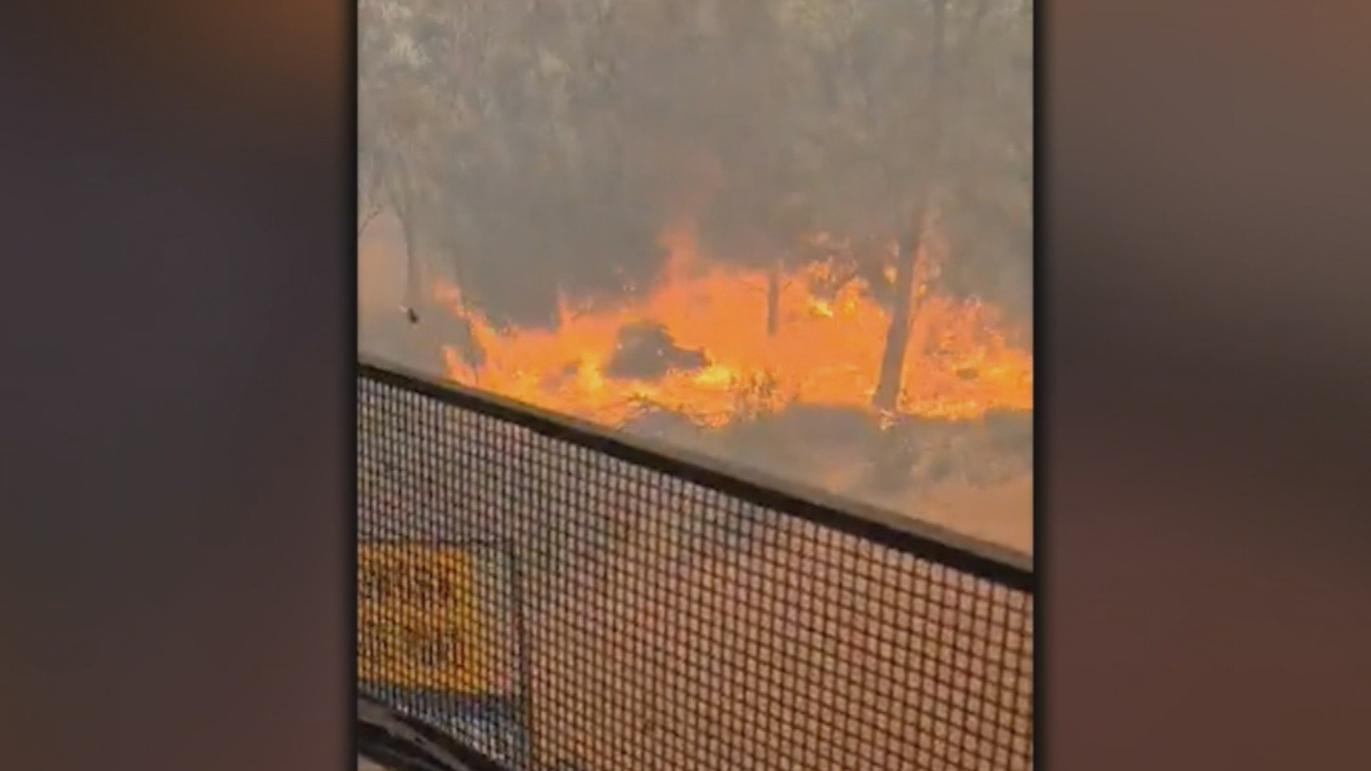 A truck driver was trapped and filmed the fire coming closer.