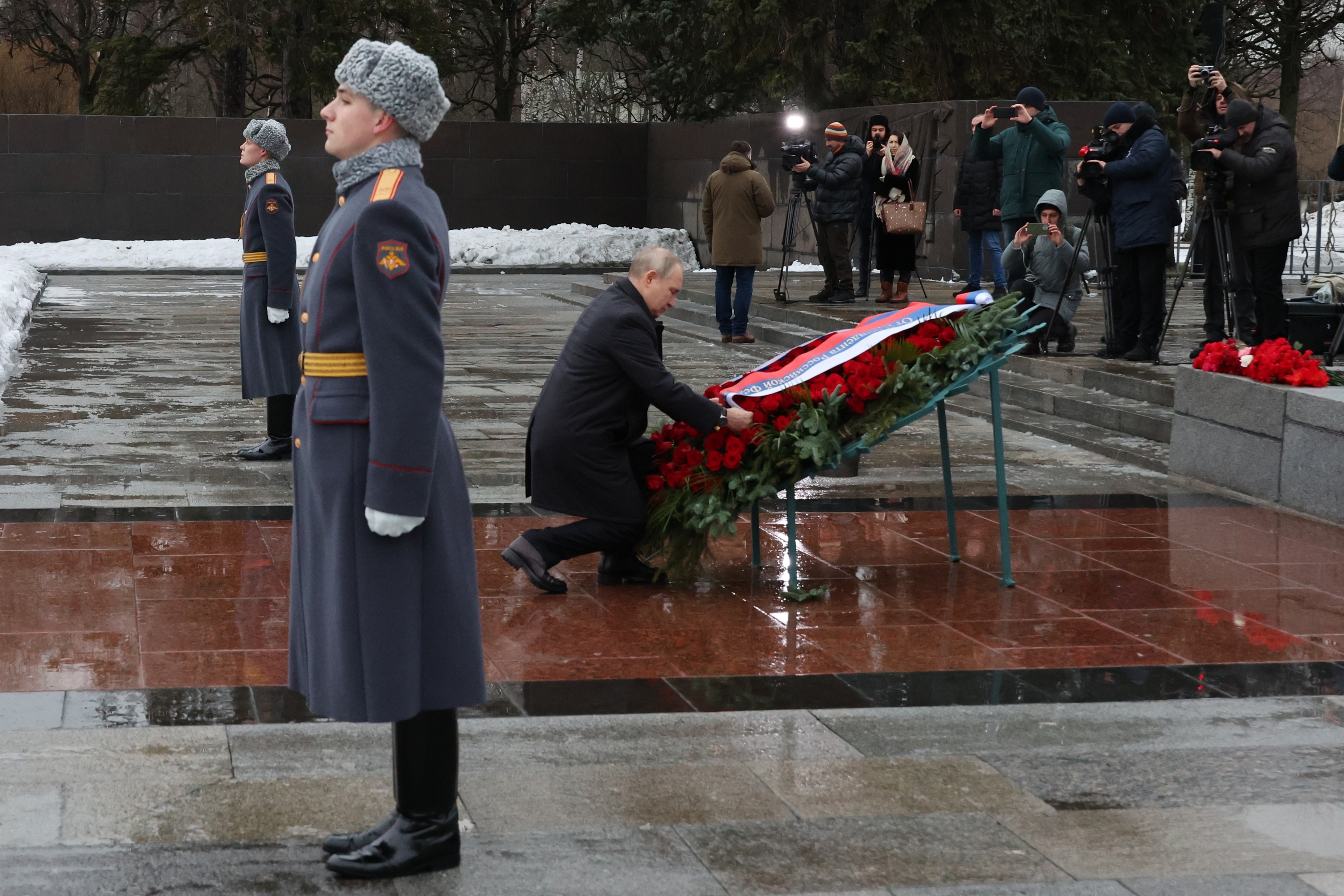 Russian President Vladimir Putin attends events marking the 80th anniversary of the break of Nazi's siege of Leningrad, (now St. Petersburg) during World War Two at the Piskaryovskoye Memorial Cemetery, where hundreds of thousands of siege victims are buried, in St. Petersburg, Russia, Wednesday, Jan. 18, 2023