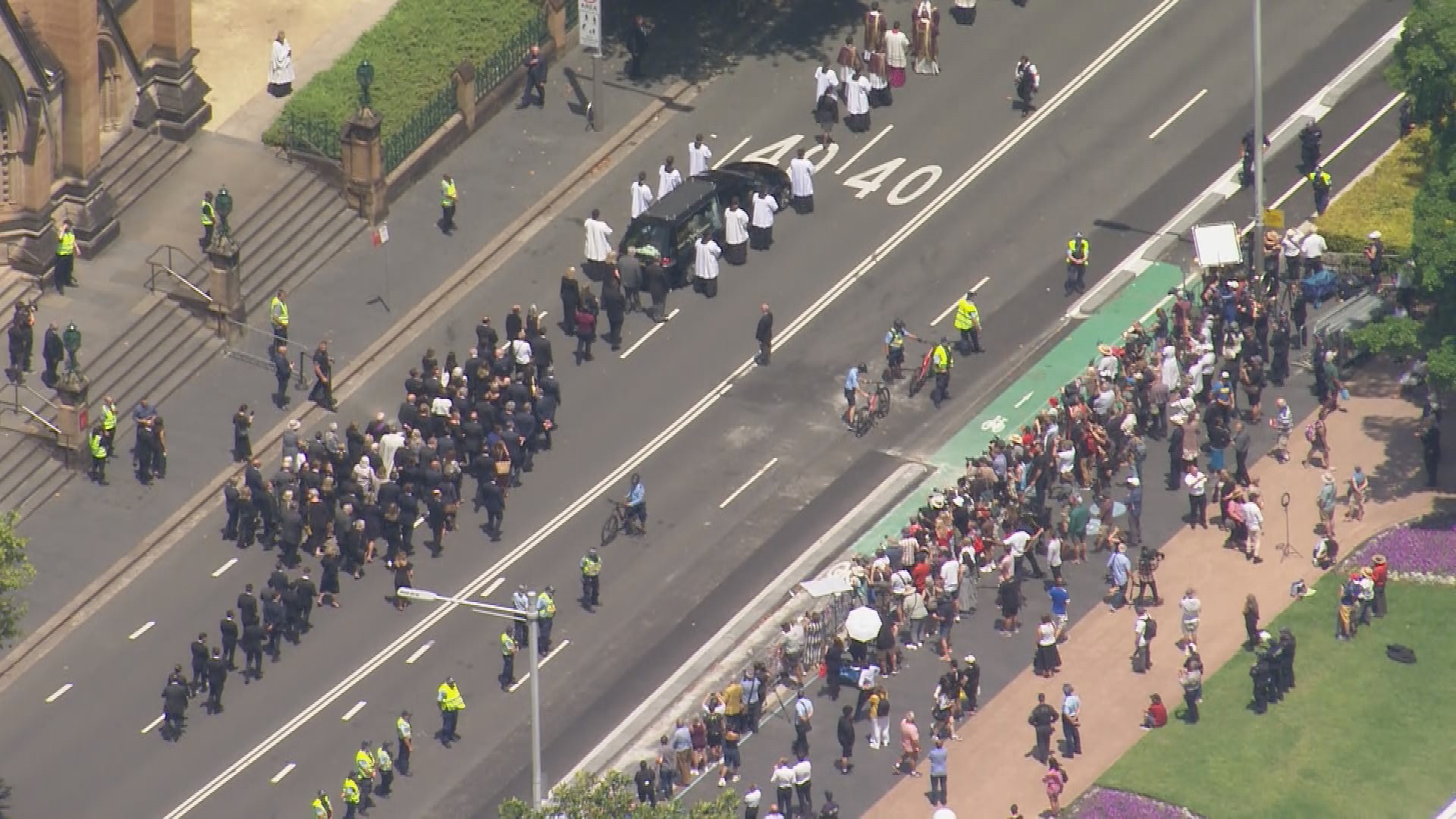 Priests and mourners made their way out of St Mary's Cathedral alongside Pell's casket.