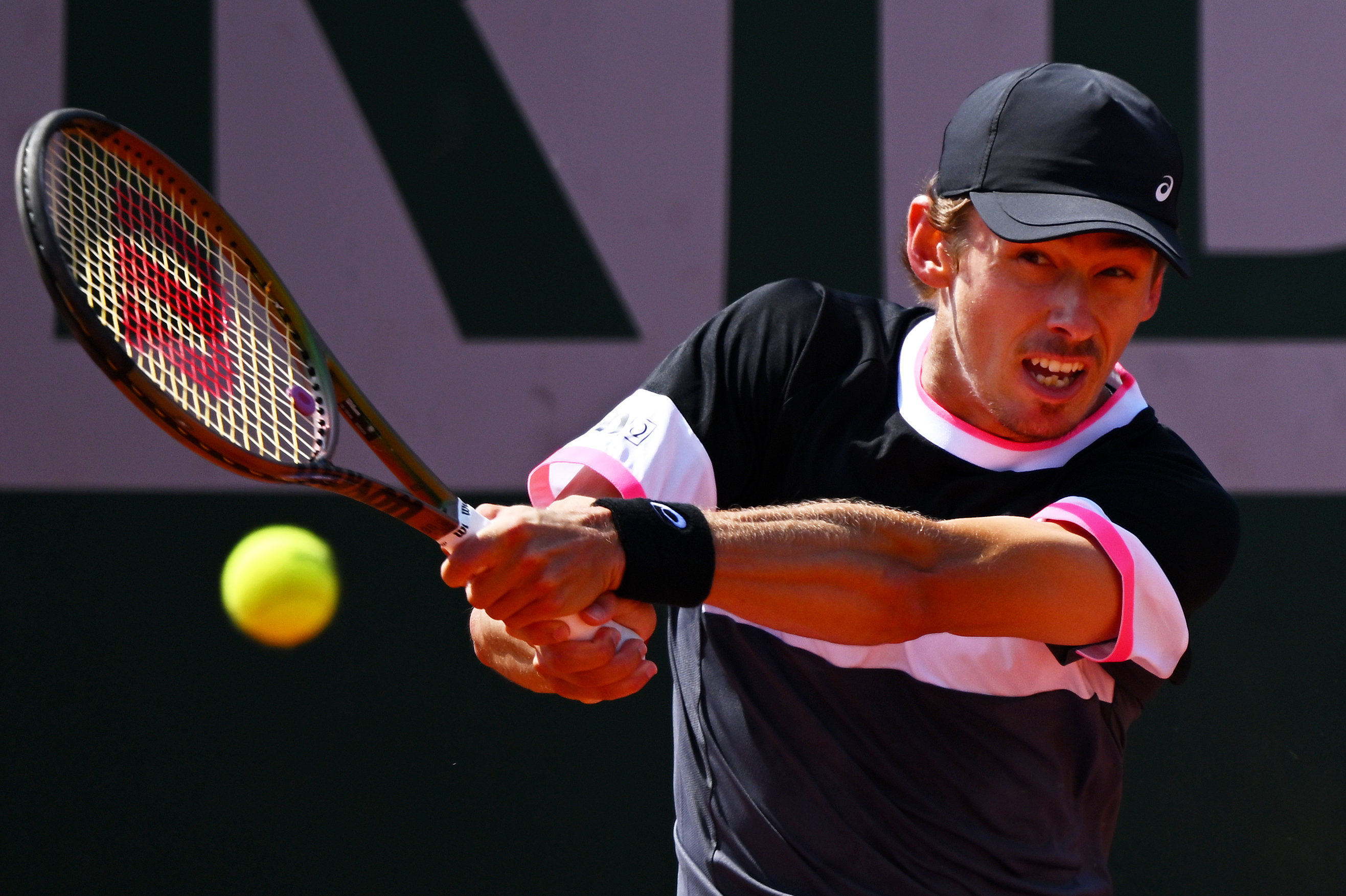Alex De Minaur of Australia plays a backhand.