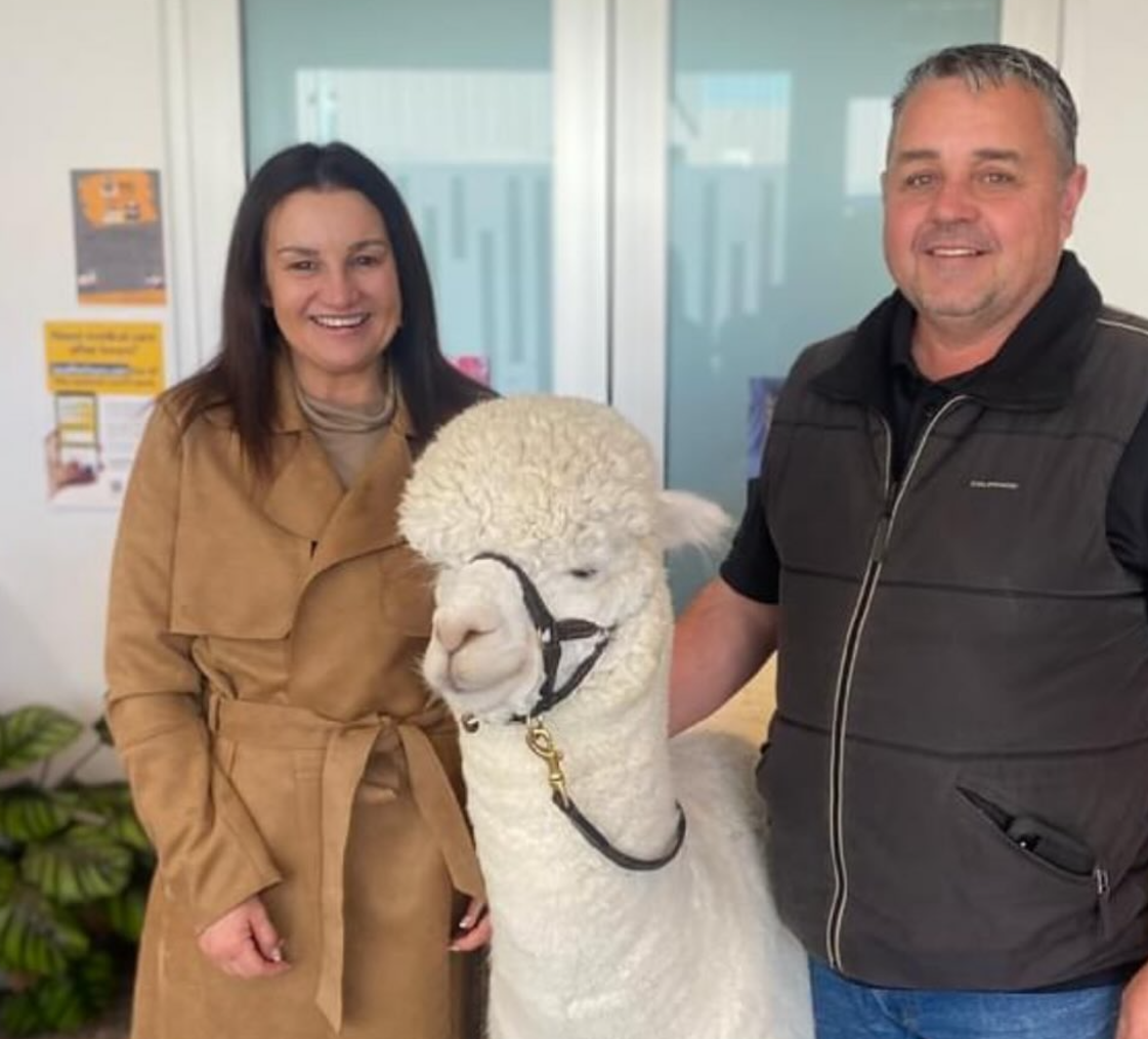 Jacqui Lambie poses with Robert Fletcher and Hephner the alpaca