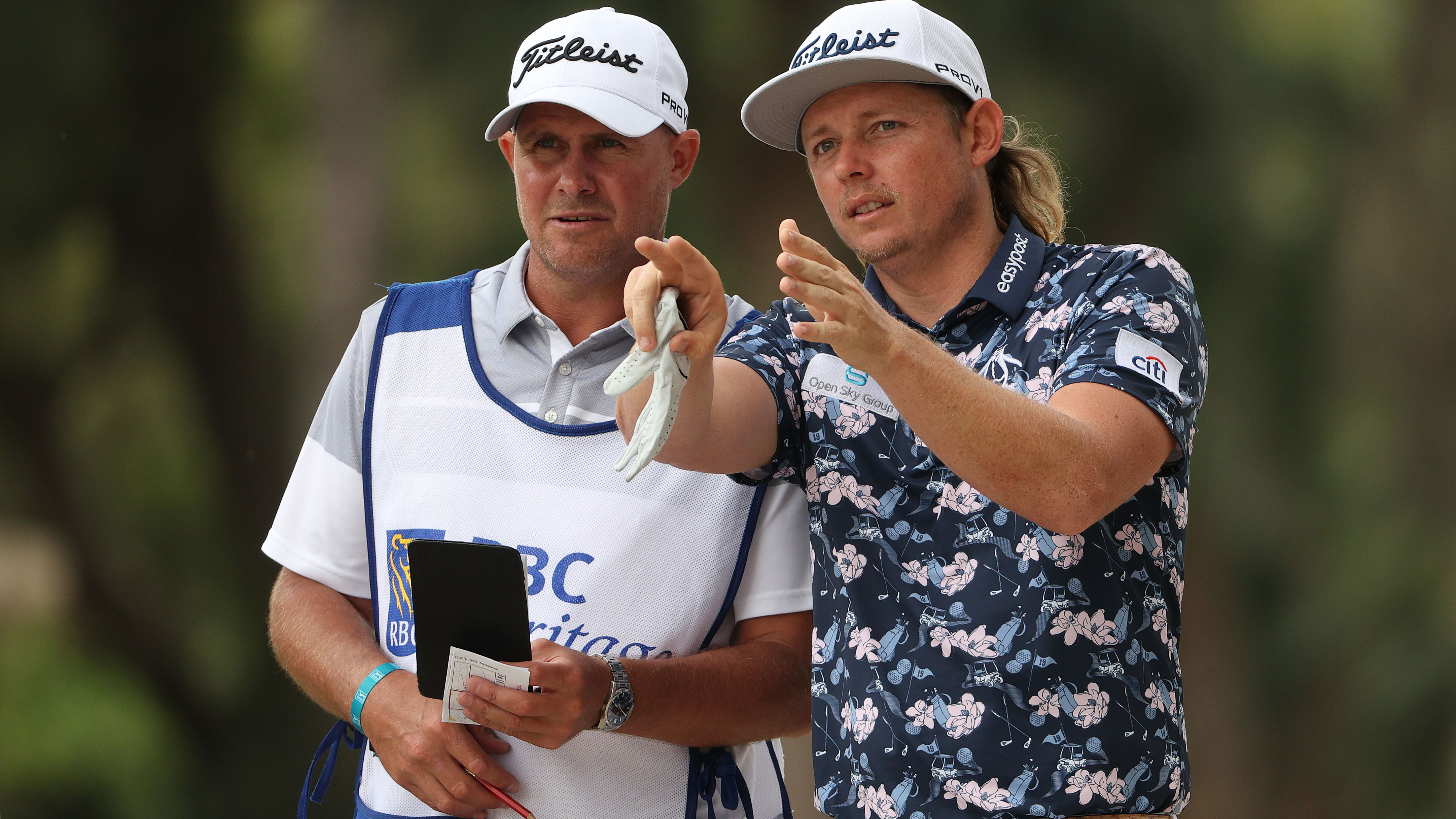 Cameron Smith consults his caddie during the first round at the Heritage.