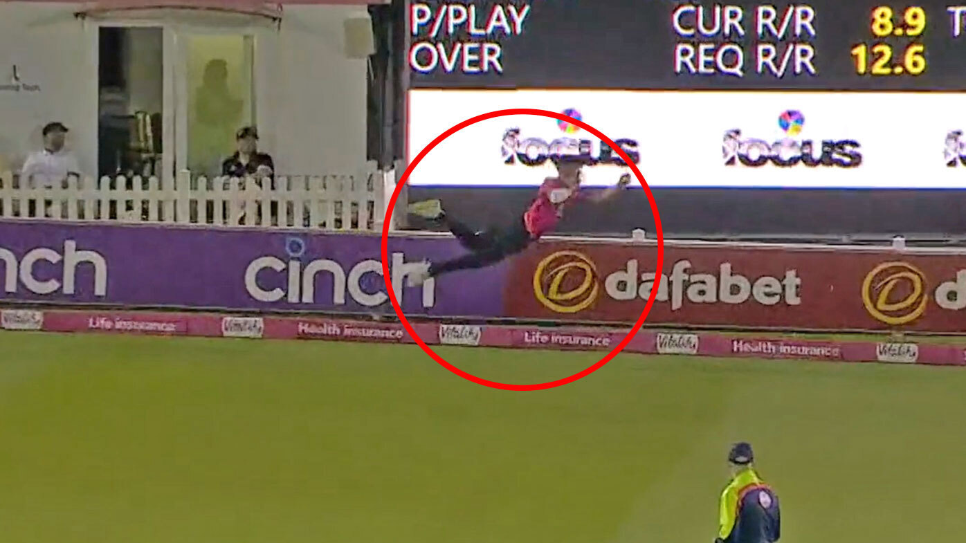 Brad Currie reacting after taking a screaming catch in an English T20 match.