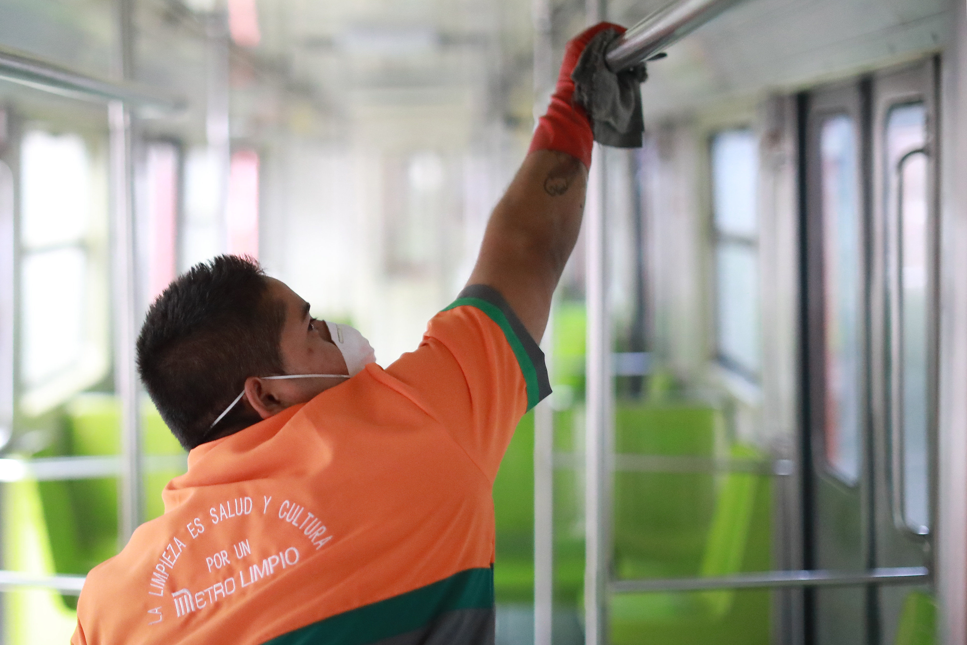 A workers disinfects a metro train car during a cleaning day at in Mexico City, Mexico.