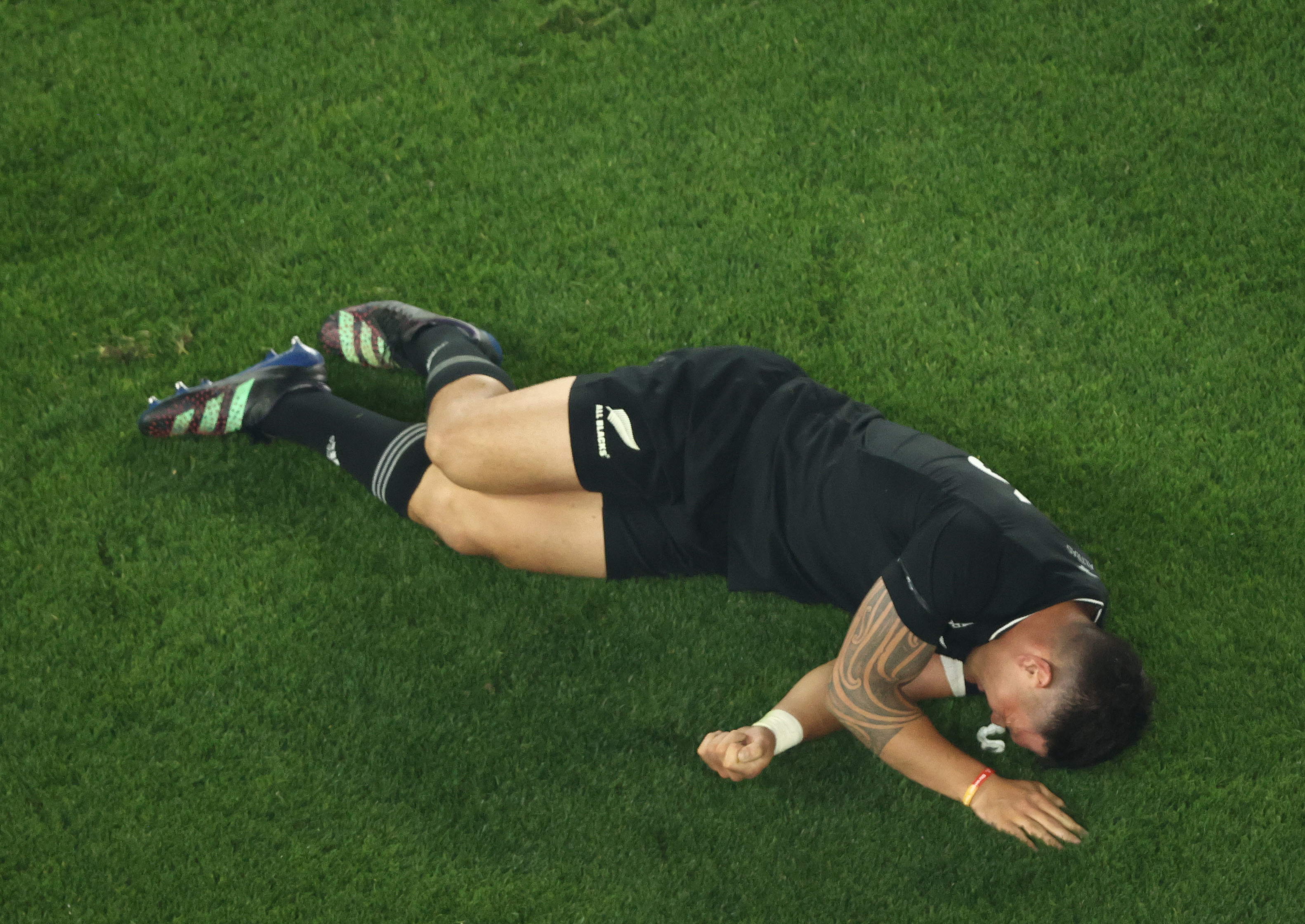 Quinn Tupaea of the All Blacks is injured at Marvel Stadium.