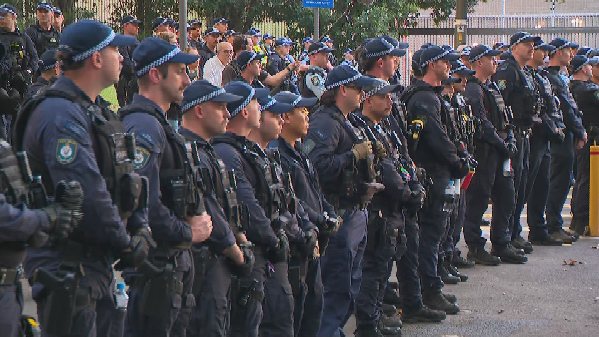 Lines of police outside Surry Hills Police Station. 