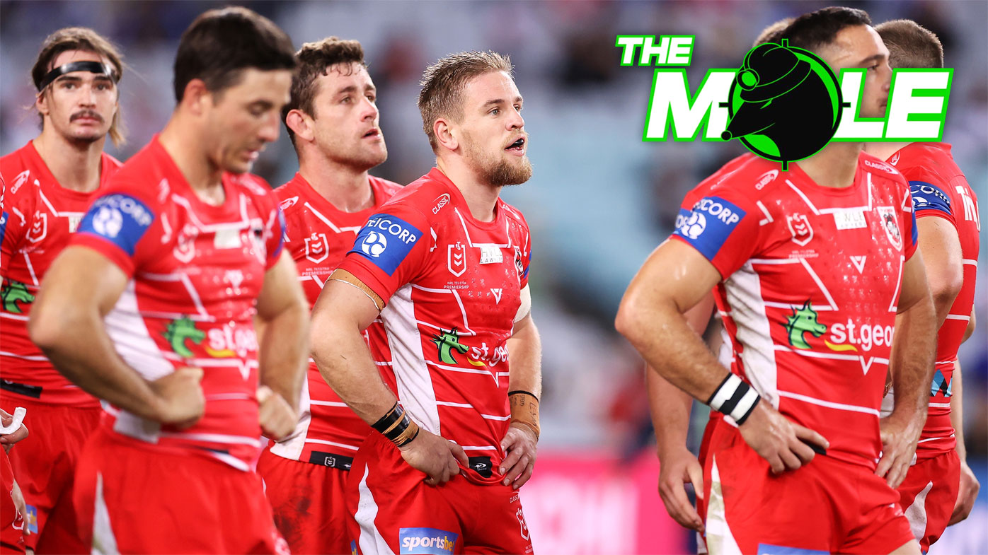 Dragons players react after conceding a try.