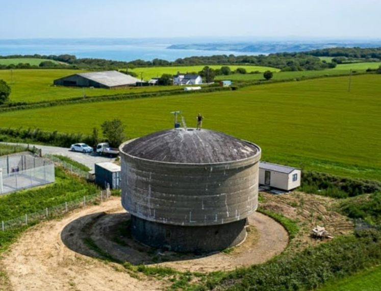 Man transforms an abandoned concrete water tower into a contemporary family home.