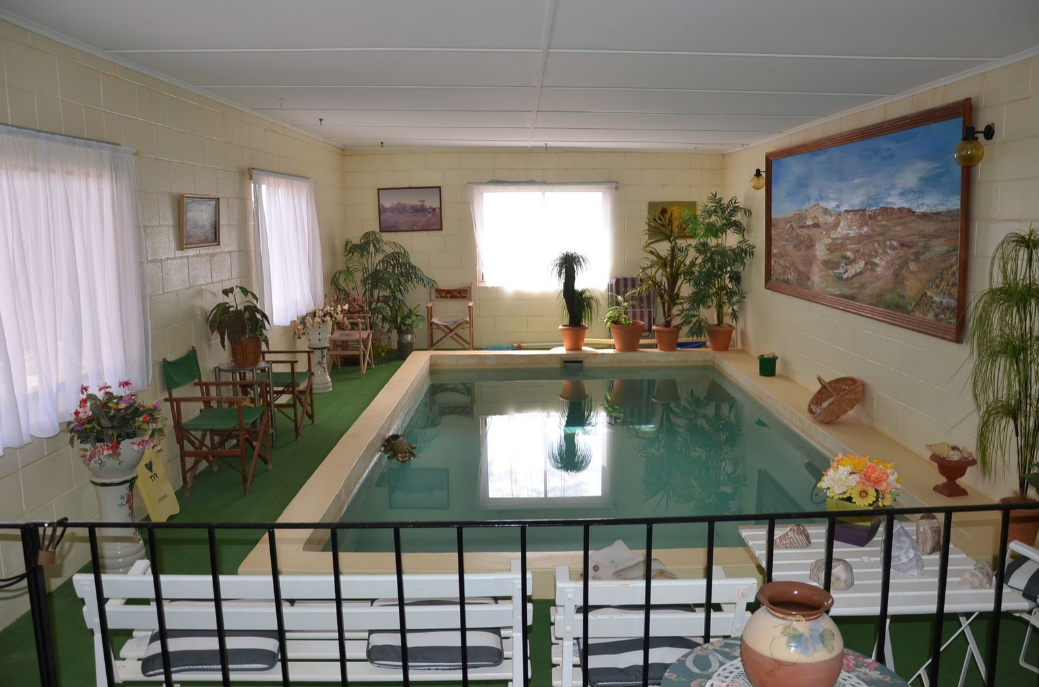 Property for sale in Coober Pedy, South Australia, with an indoor swimming pool. 