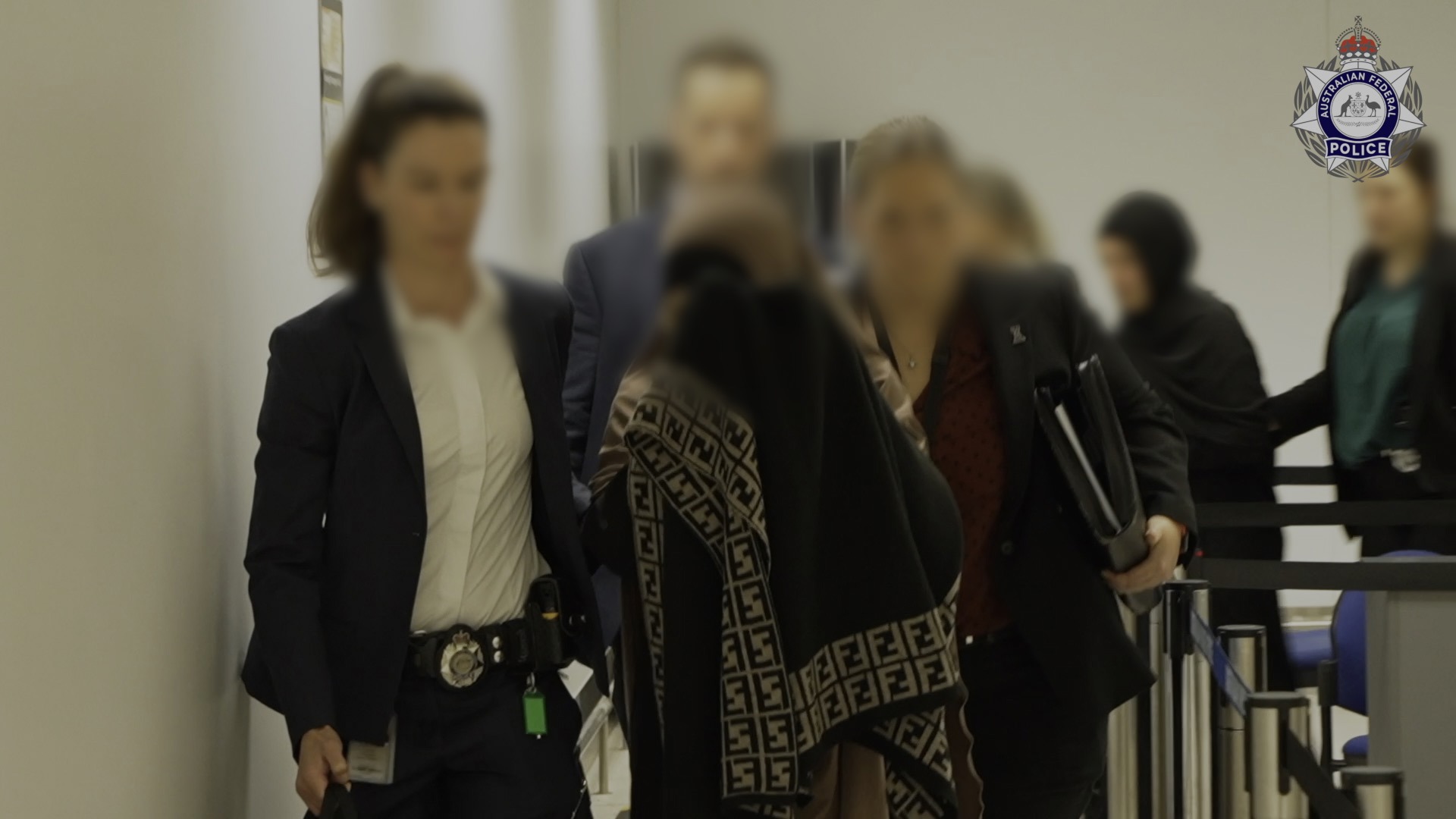 Federal officers lay slavery charges against two brides who landed in Melbourne