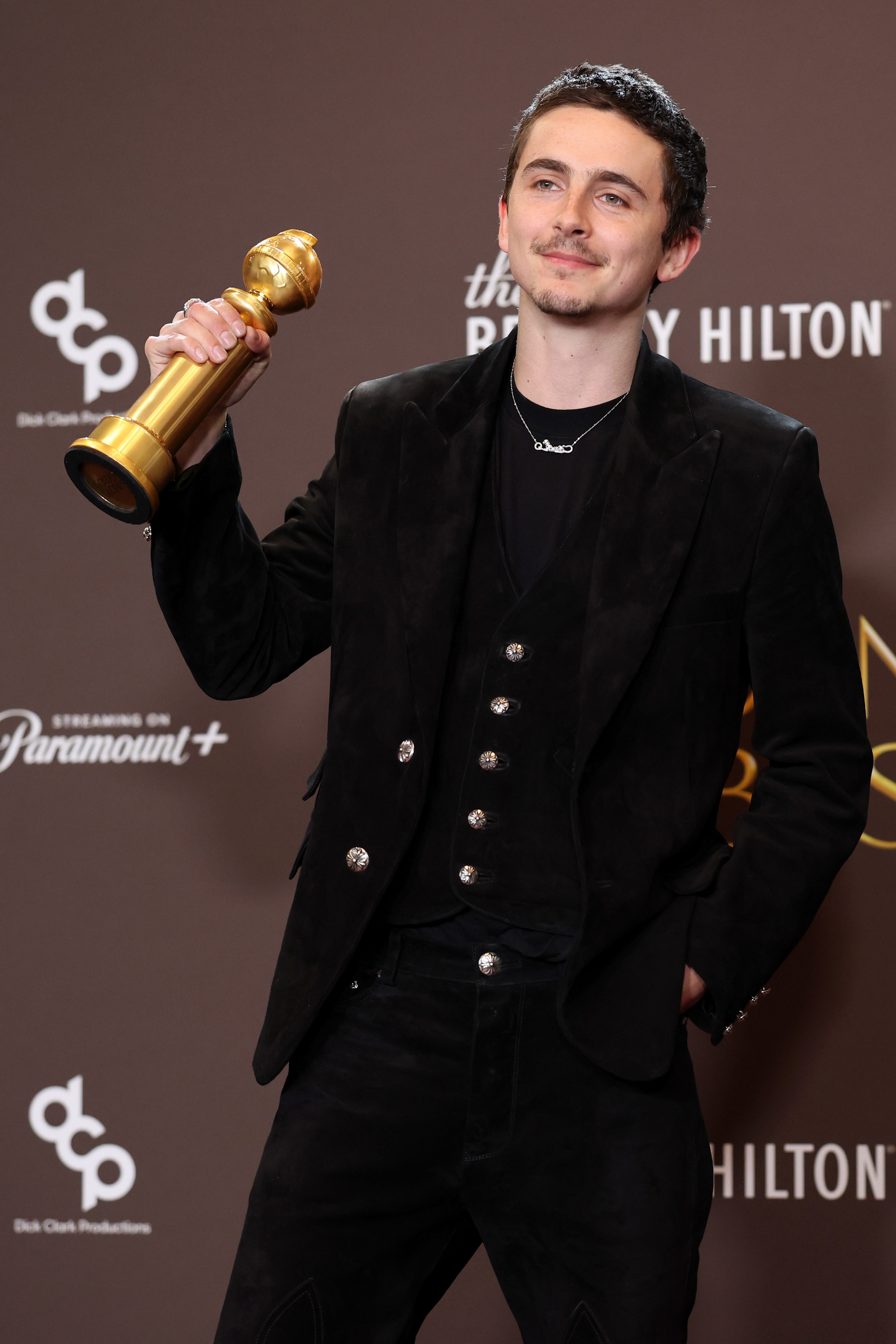 BEVERLY HILLS, CALIFORNIA - JANUARY 11: (FOR EDITORIAL USE ONLY) Timothée Chalamet, winner of the Best Performance by a Male Actor in a Motion Picture  Musical or Comedy Award for 