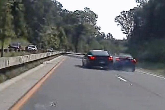 In an image taken from Connecticut State Police police dashcam video, Vince McMahon's car, center left, collides with another car after on July 24, 2025, in Westport, Ct. 