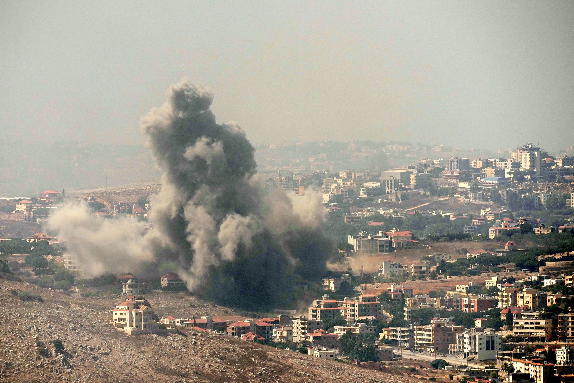 Smoke rises from Israeli airstrikes in the southern village of Kfar Rouman, seen from Marjayoun in south Lebanon on Wednesday, September 25.