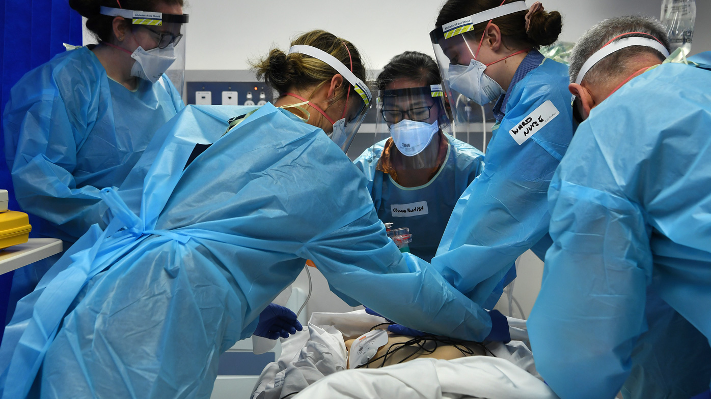Doctors and nurses during simulated pandemic training where the scenario is that a COVID-19 patient goes into cardiac arrest at St Vincent's Hospital, in Sydney, Australia.