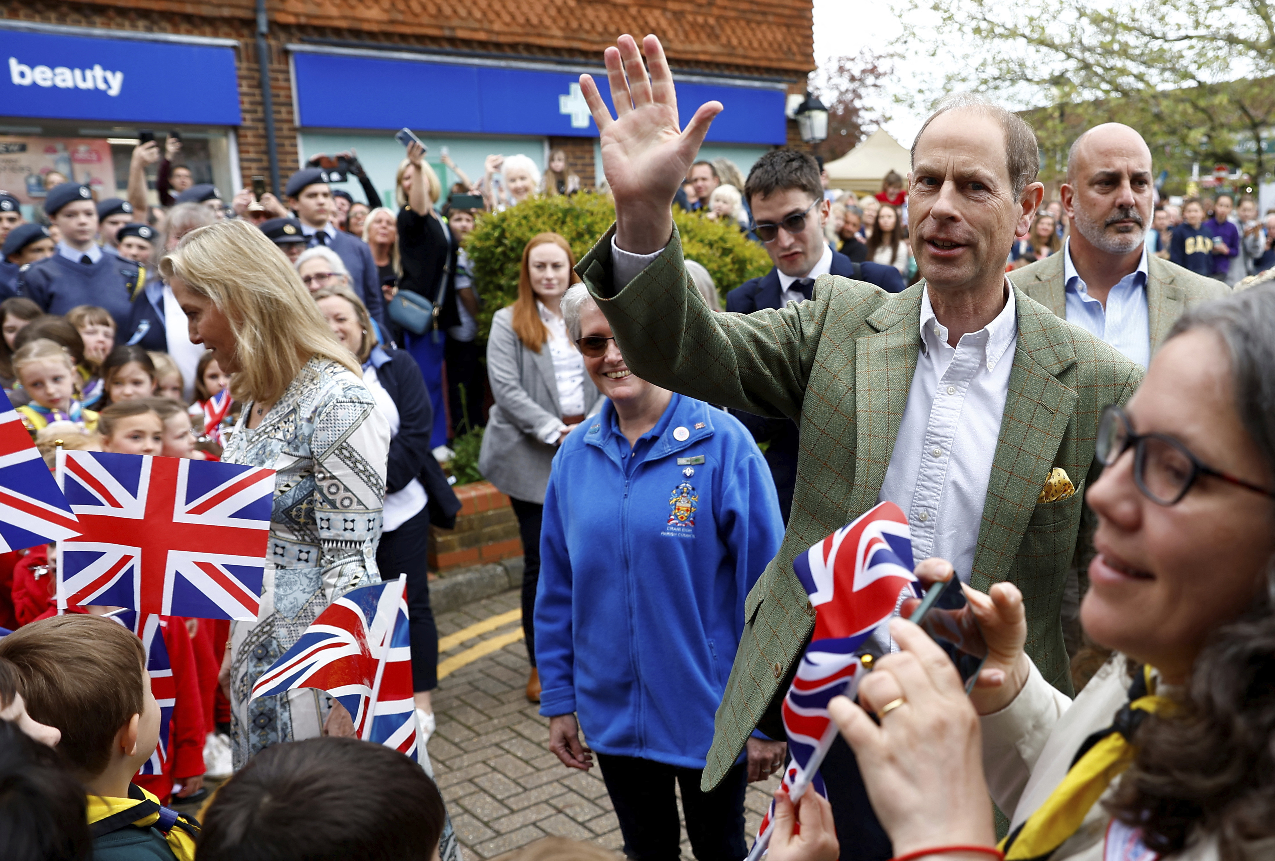 Prince Edward and Sophie, Duchess of Edinburgh arrive to attend a Big Lunch with residents and representatives from the Royal British Legion, the Scouts and the Guides, in Cranleigh Village Hall.