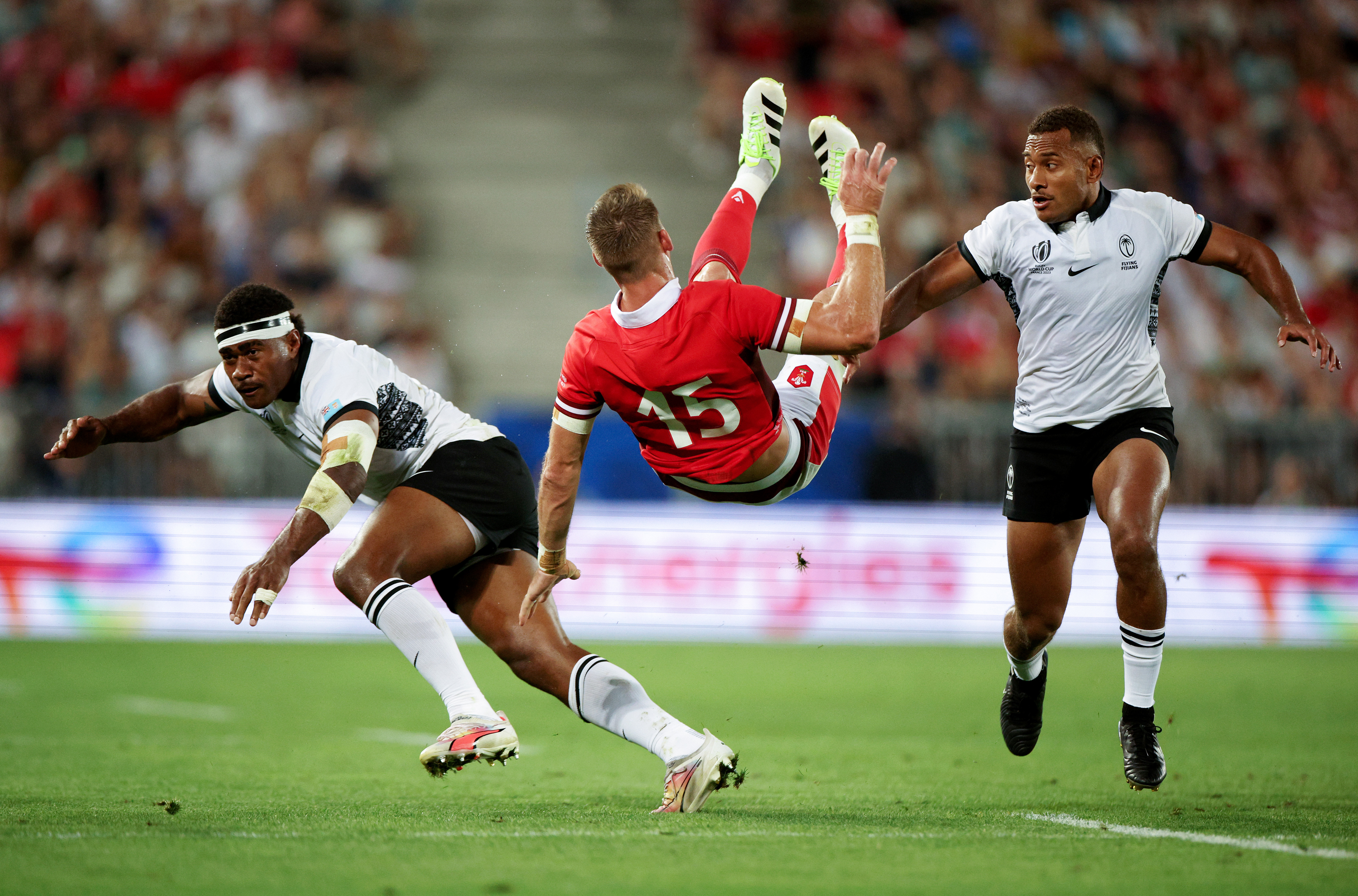 Vinaya Habosi of Fiji commits an illegal no arms challenge on Liam Williams of Wales.