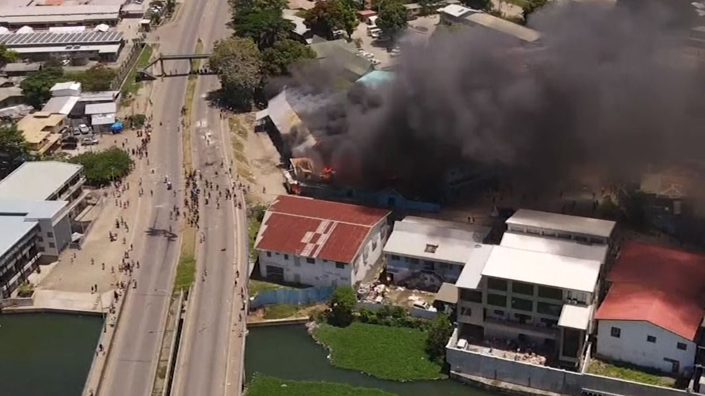 A building up in flames in Honiara.