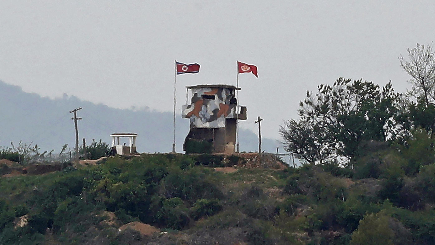 In this May 3, 2020, file photo, a North Korean flag flutters in the wind at a military guard post in Paju, at the border with North Korea