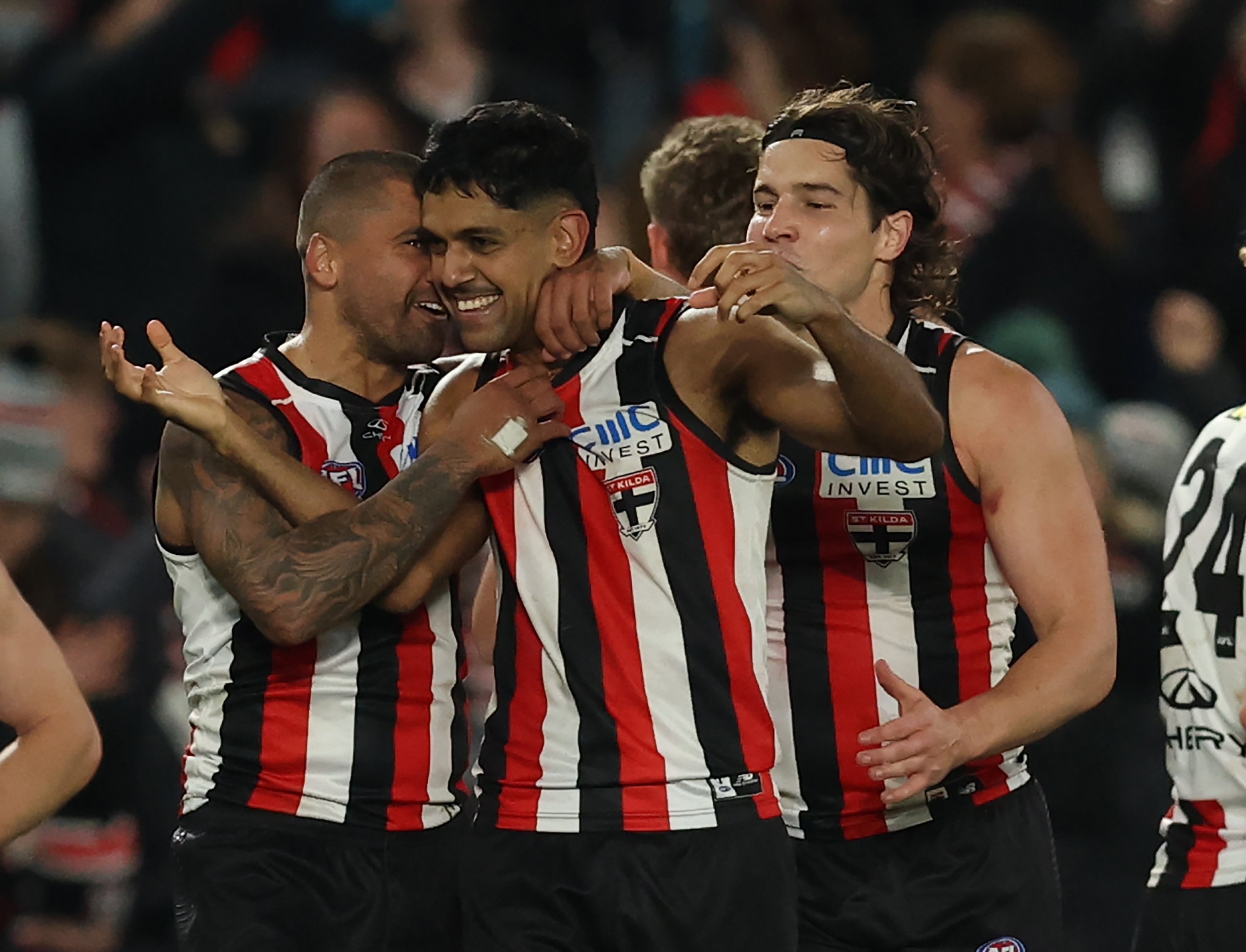Nasiah Wanganeen-Milera and his teammates celebrate the match-winning goal.